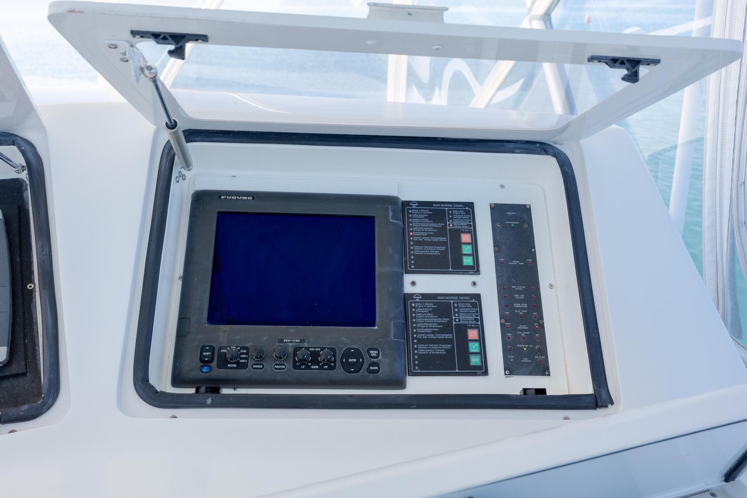 Control panel on a 2000 Viking 55 Convertible yacht, featuring navigation and system displays.