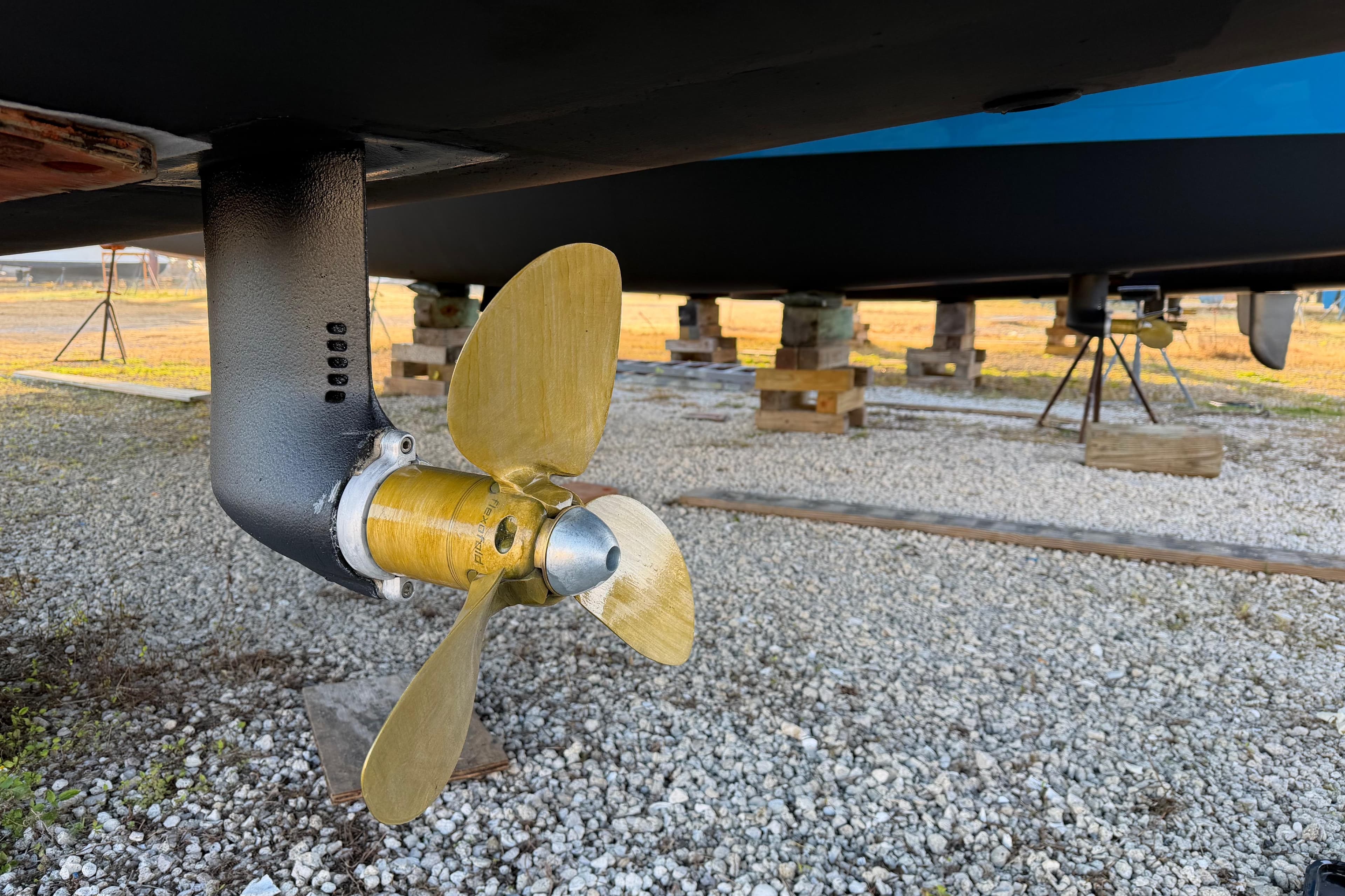 Propeller of 2025 C-Catamarans 48 on dry dock, showcasing marine engineering.