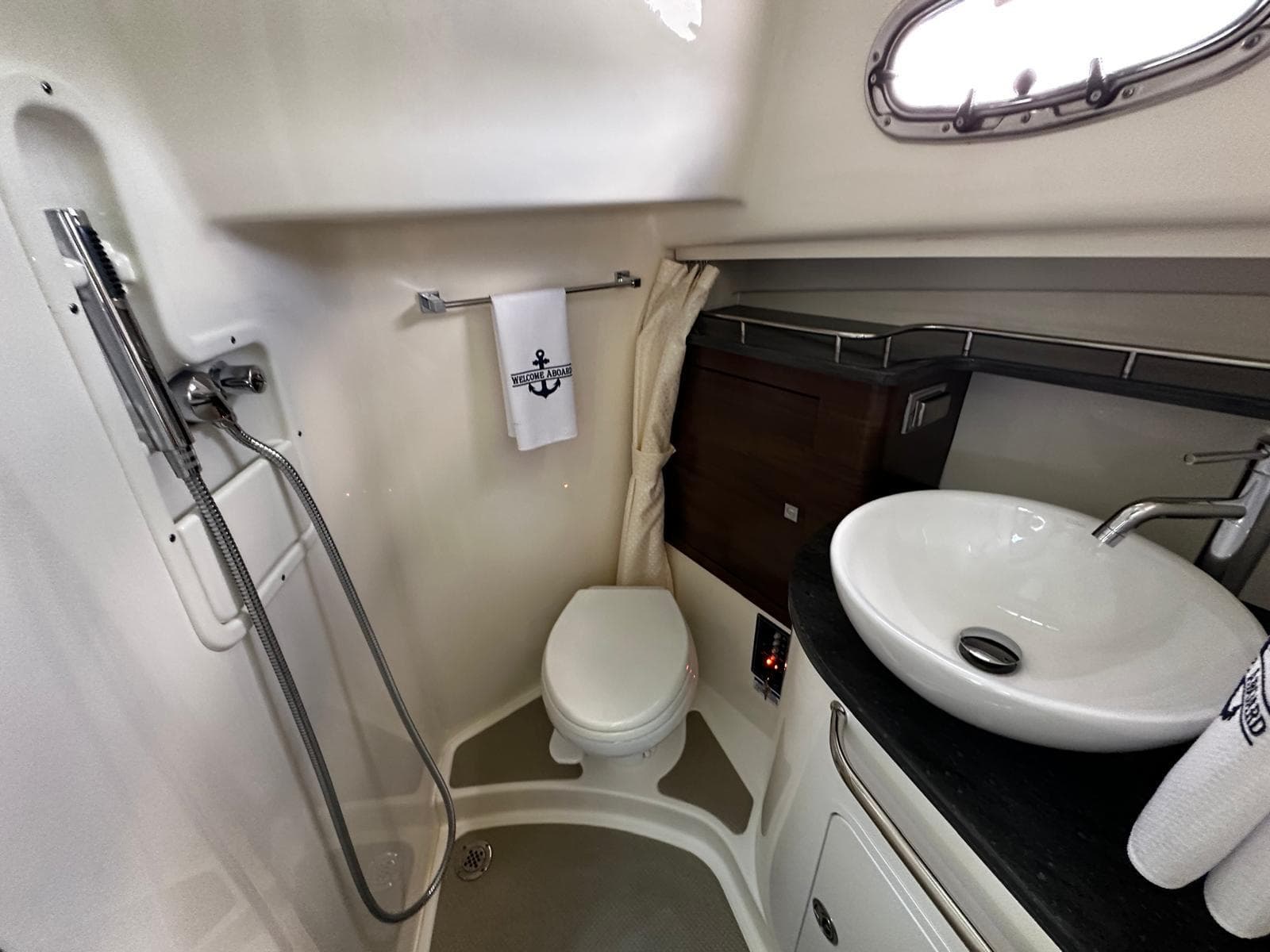 2022 Boston Whaler 345 Conquest bathroom with shower, sink, and toilet.