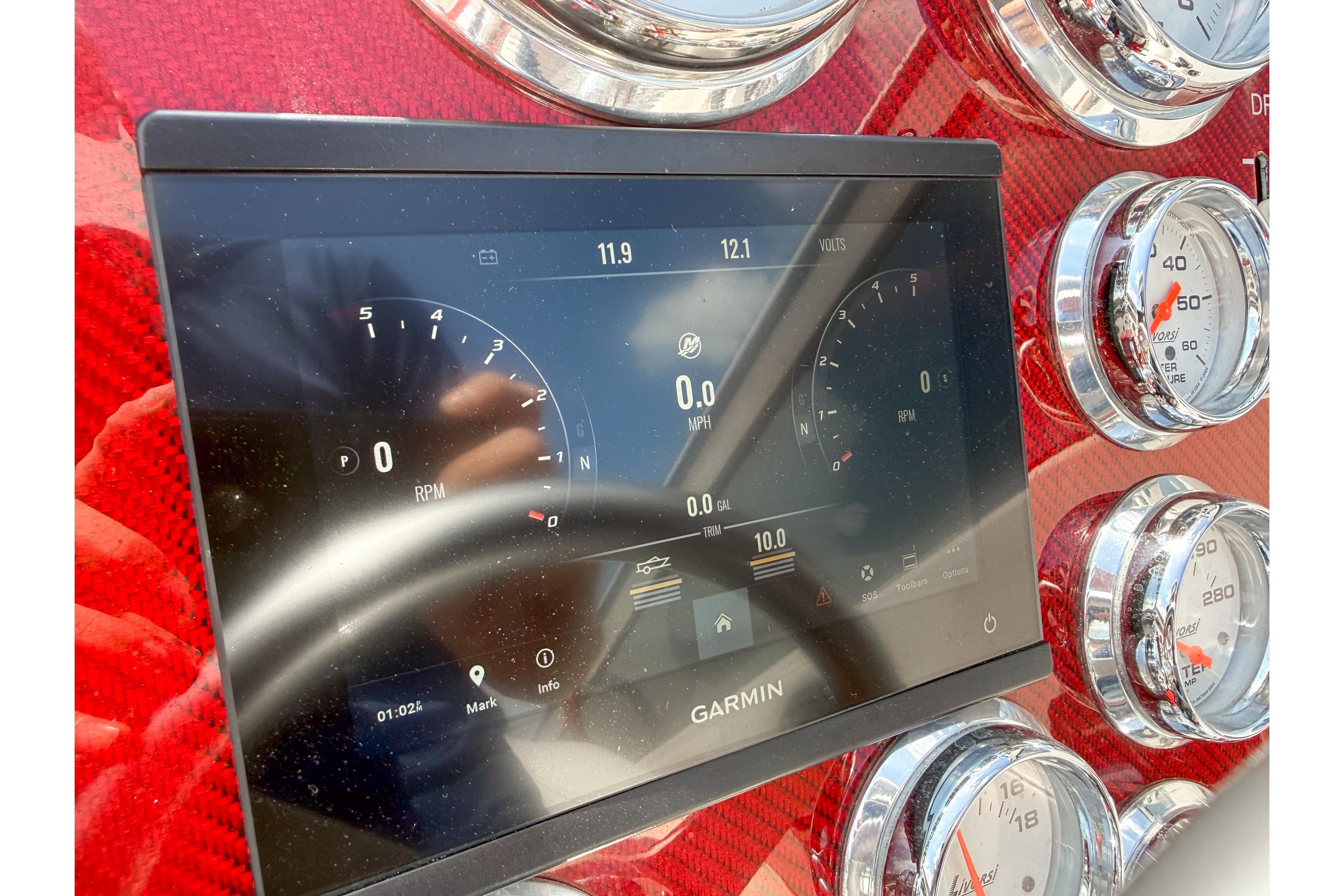 Dashboard of a 2007 Fountain 42 Lightning boat with Garmin display and gauges.