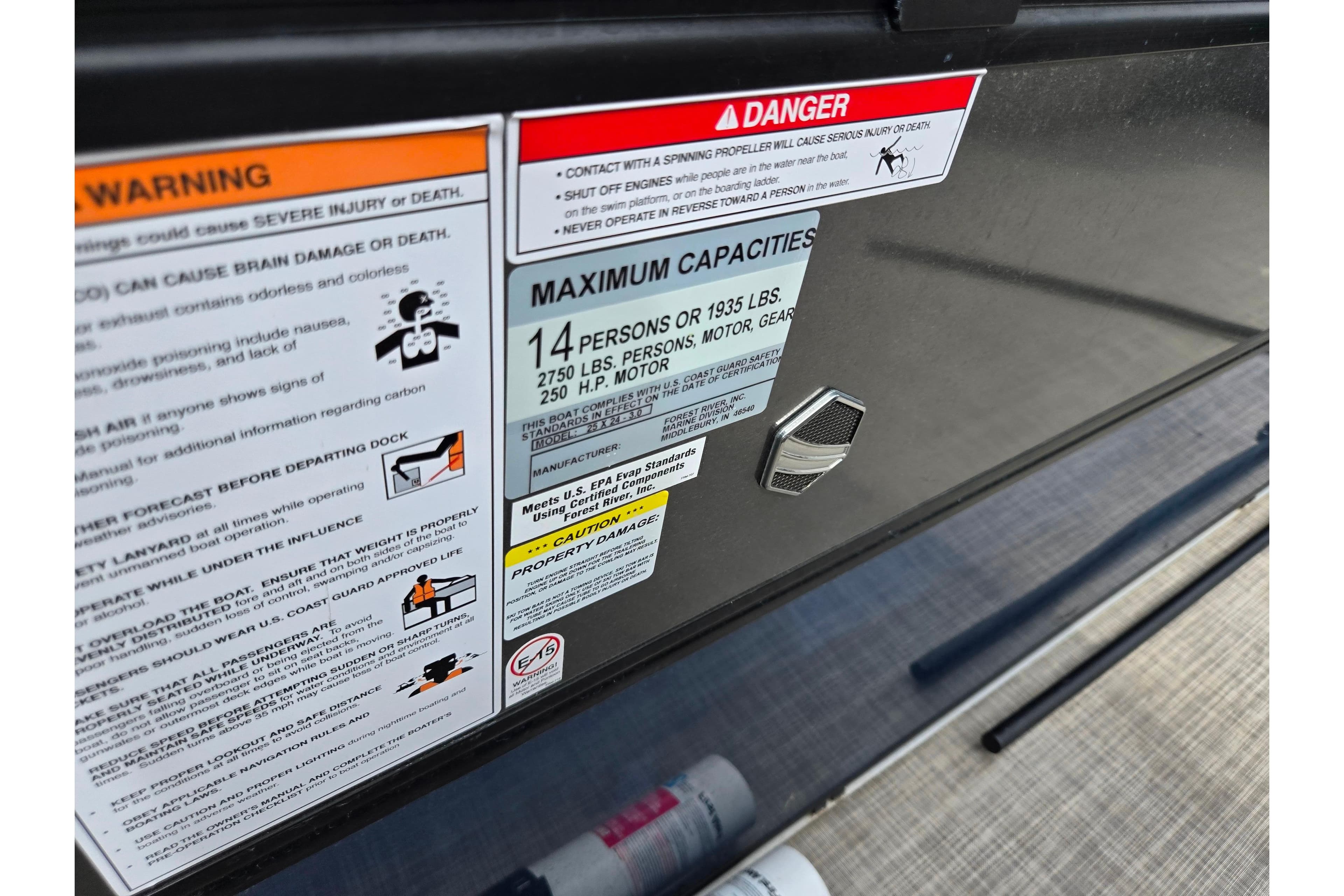 Warning and capacity labels on 2019 South Bay S224FCR boat.