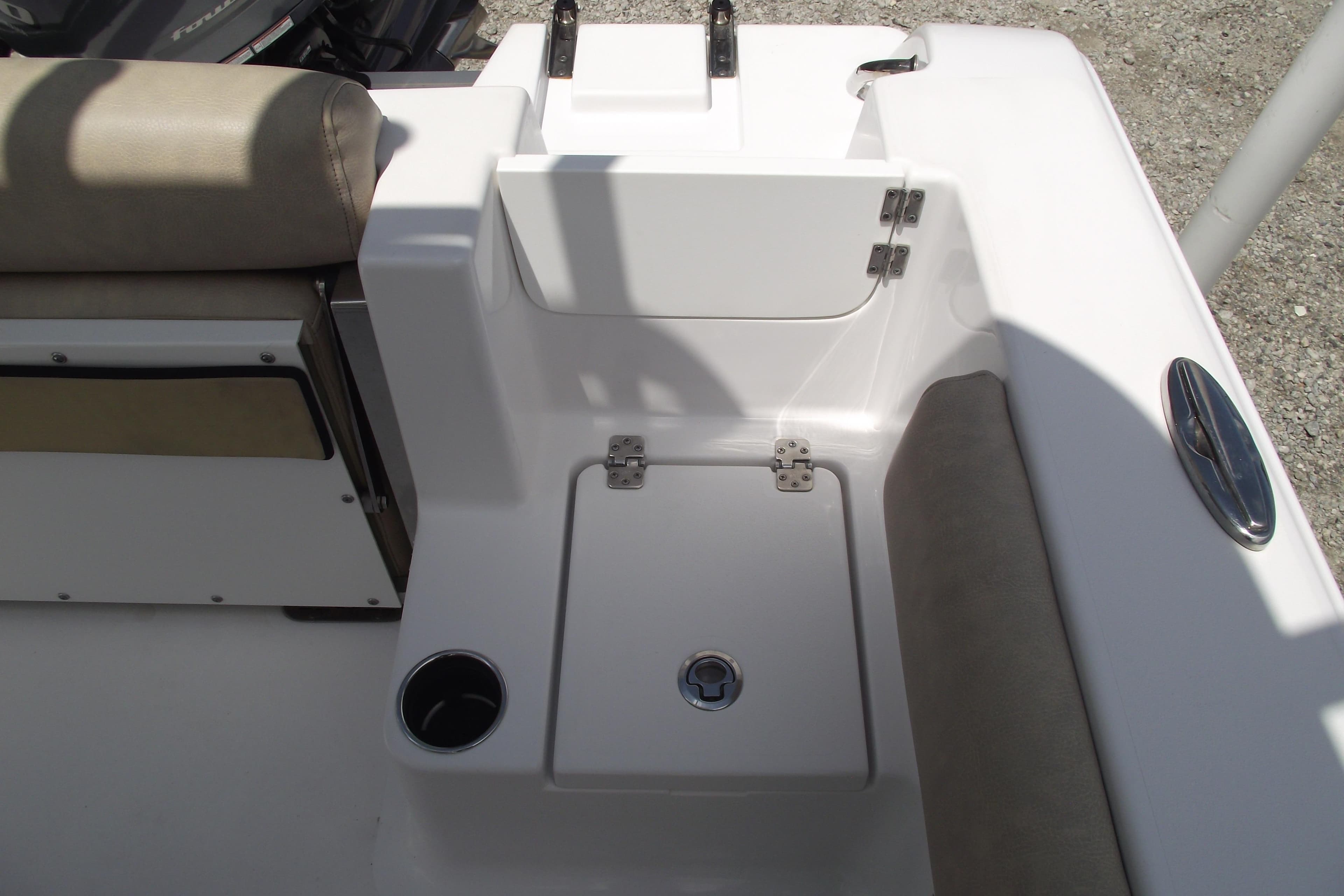2020 Sportsman Open 212 Center Console boat interior with seating and storage compartment.