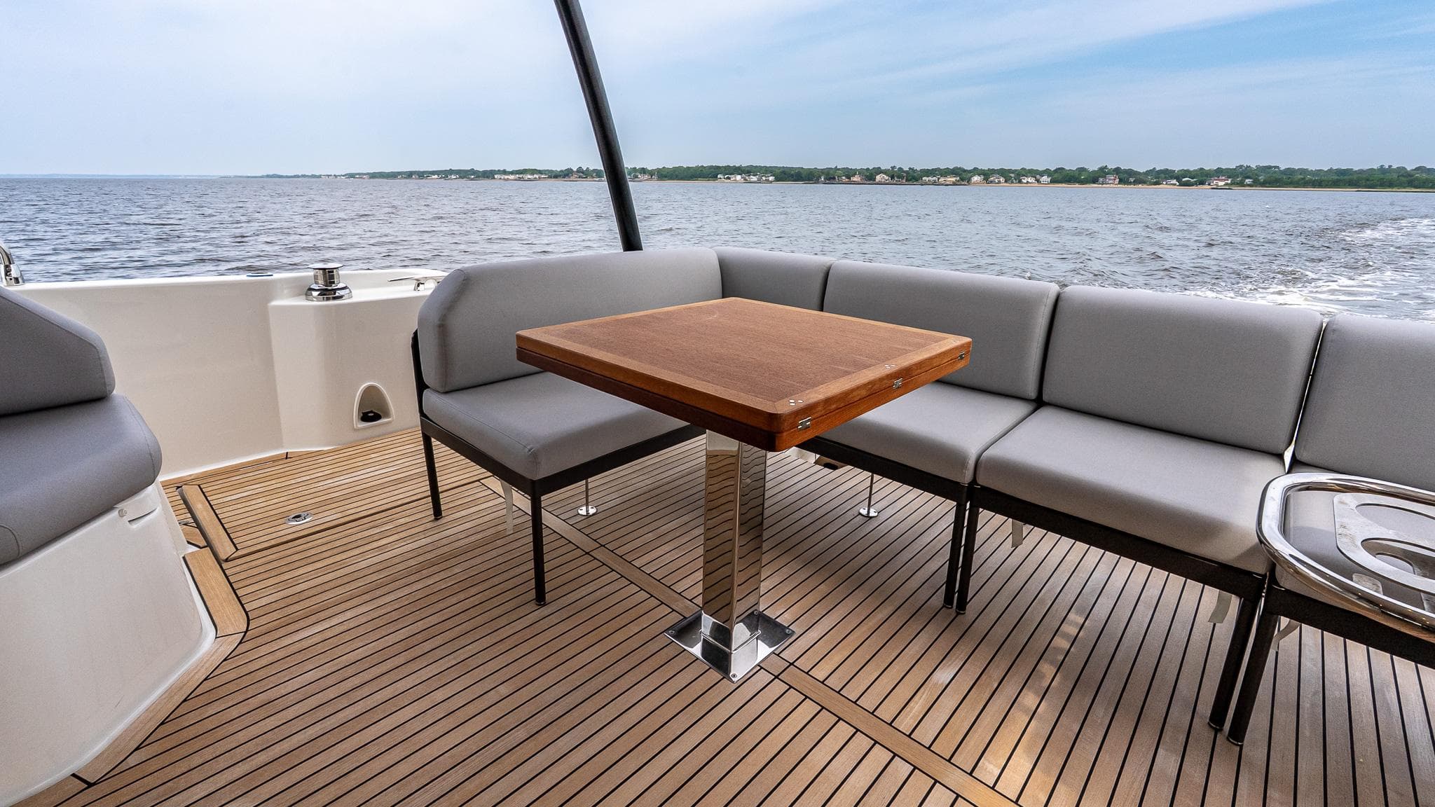 Luxurious 2026 Prestige M48 yacht deck with seating and ocean view.