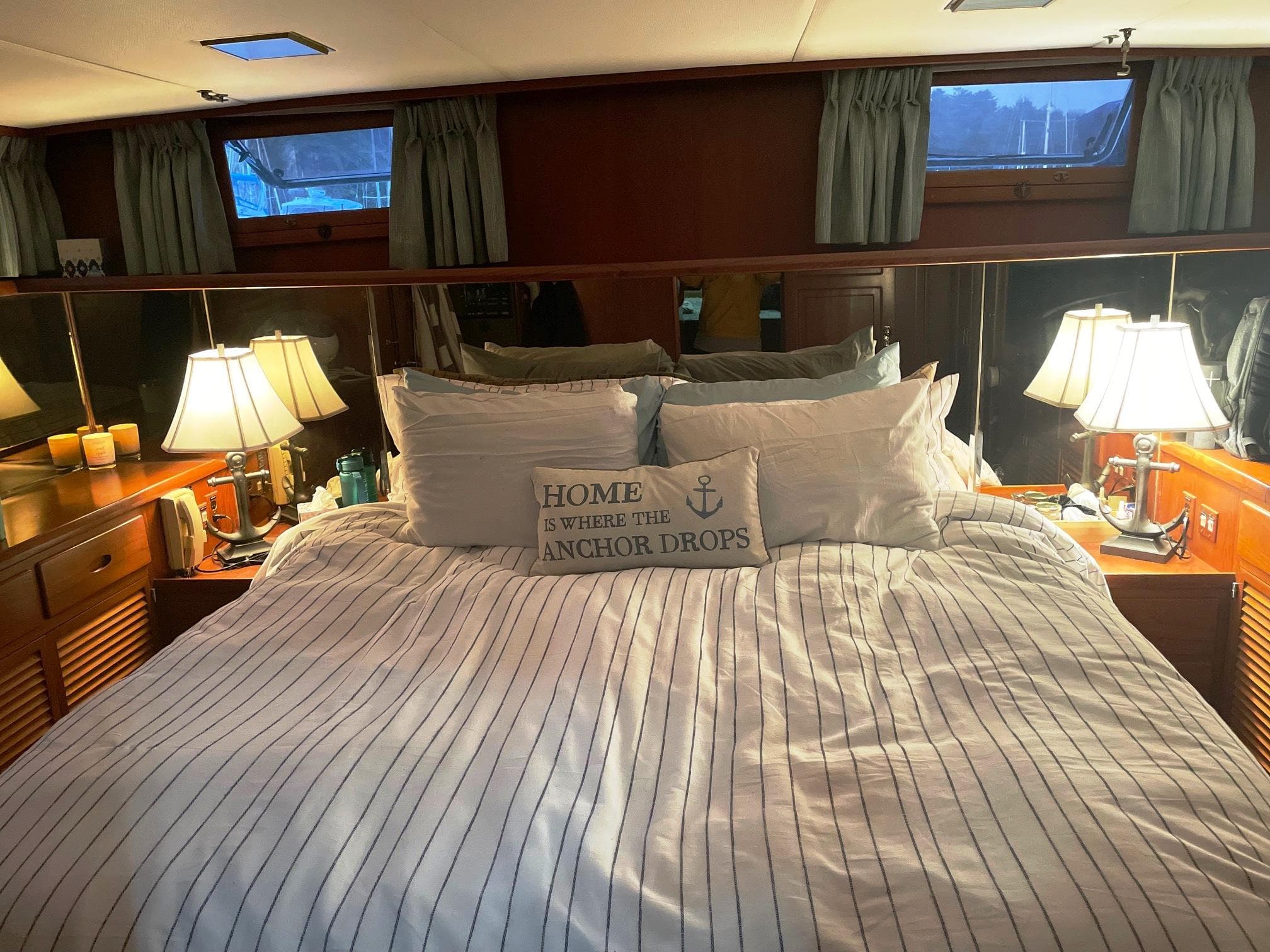 Cozy bedroom in 1989 Marine Trader 47 CMY yacht with nautical decor and ambient lighting.