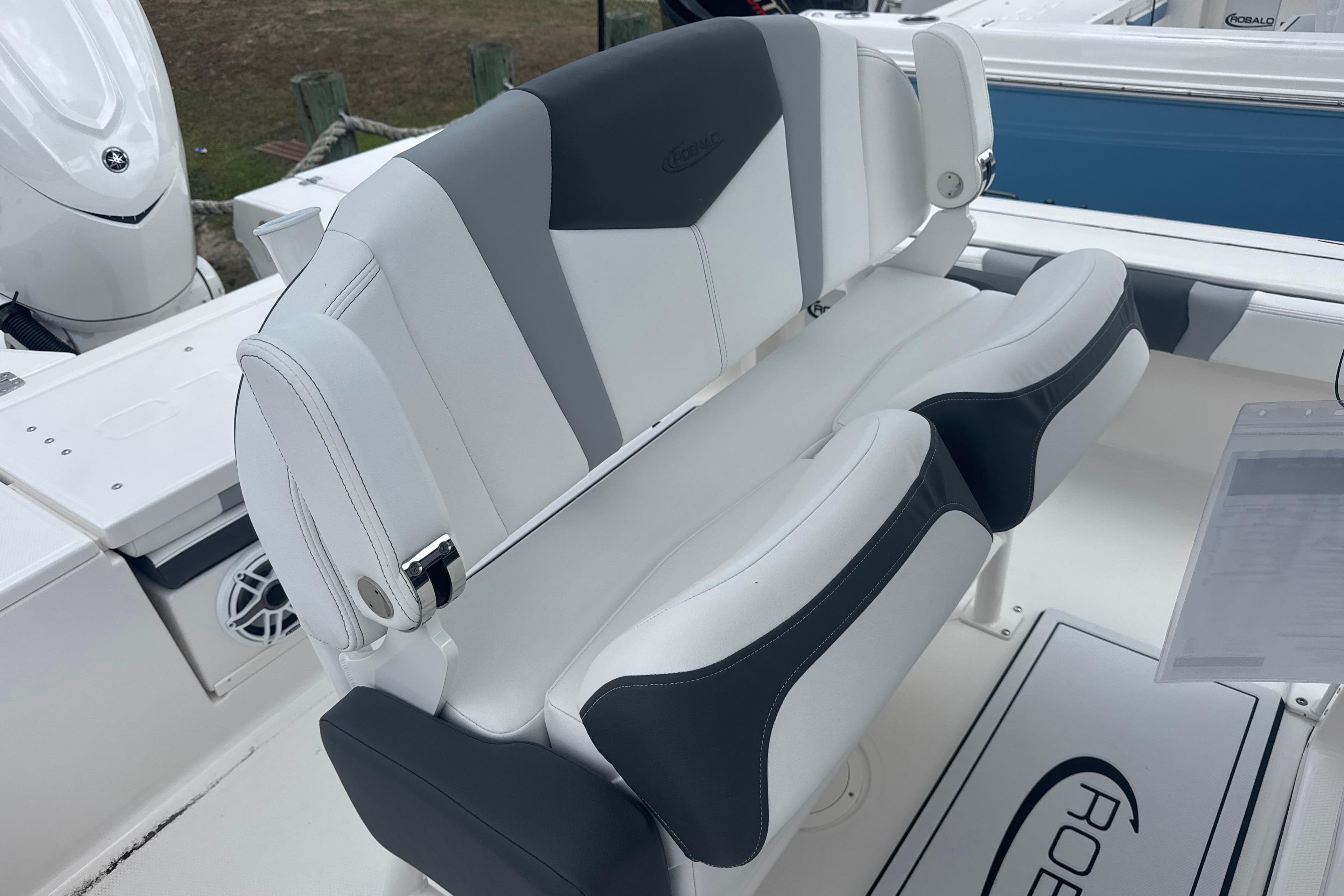 2026 Robalo 246 Cayman boat with stylish white and gray seating.