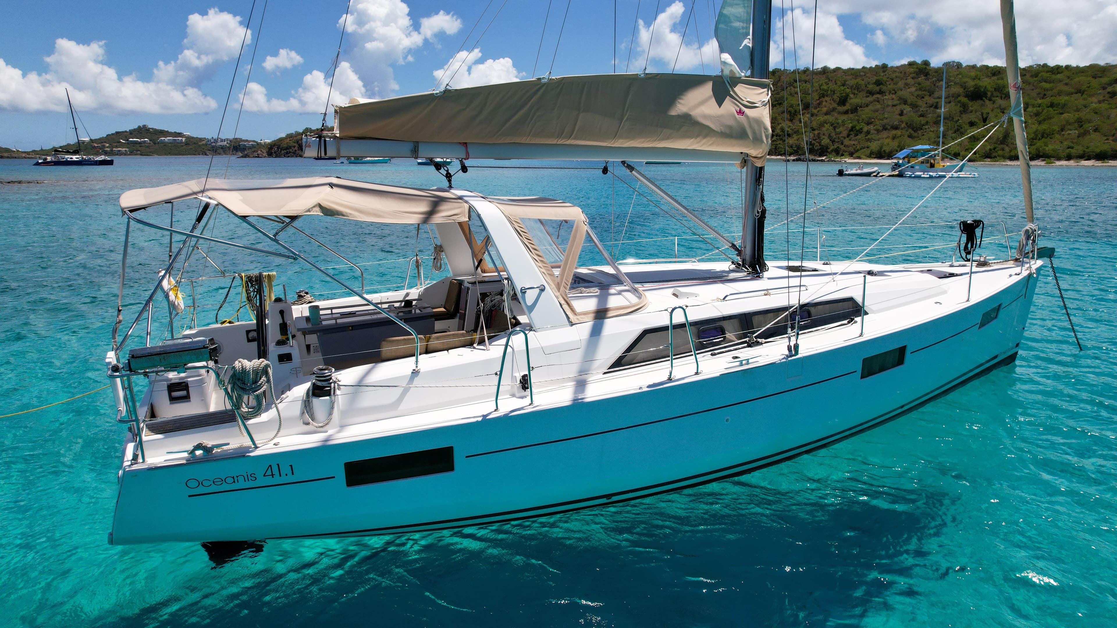 2018 Beneteau Oceanis 41.1 sailboat anchored in clear turquoise waters.