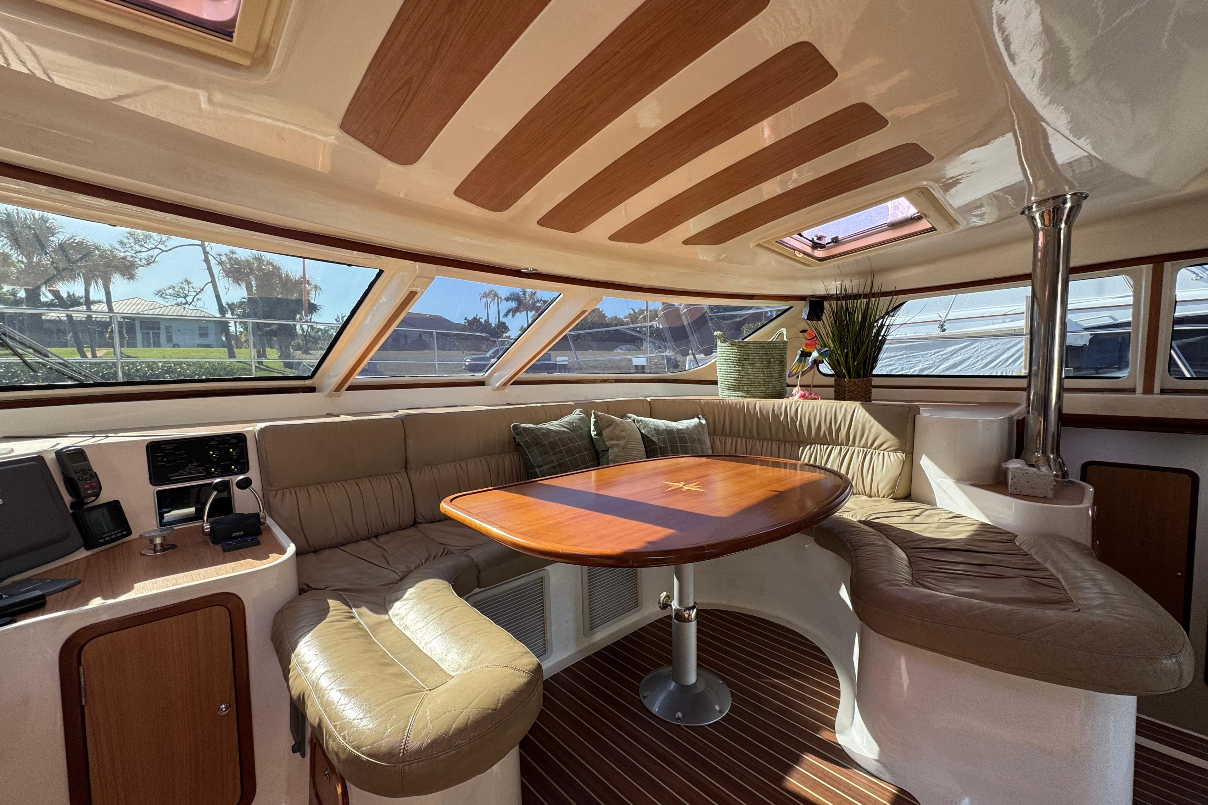 Luxurious interior of 2007 Africat Marine 420 yacht with plush seating and elegant wood finishes.
