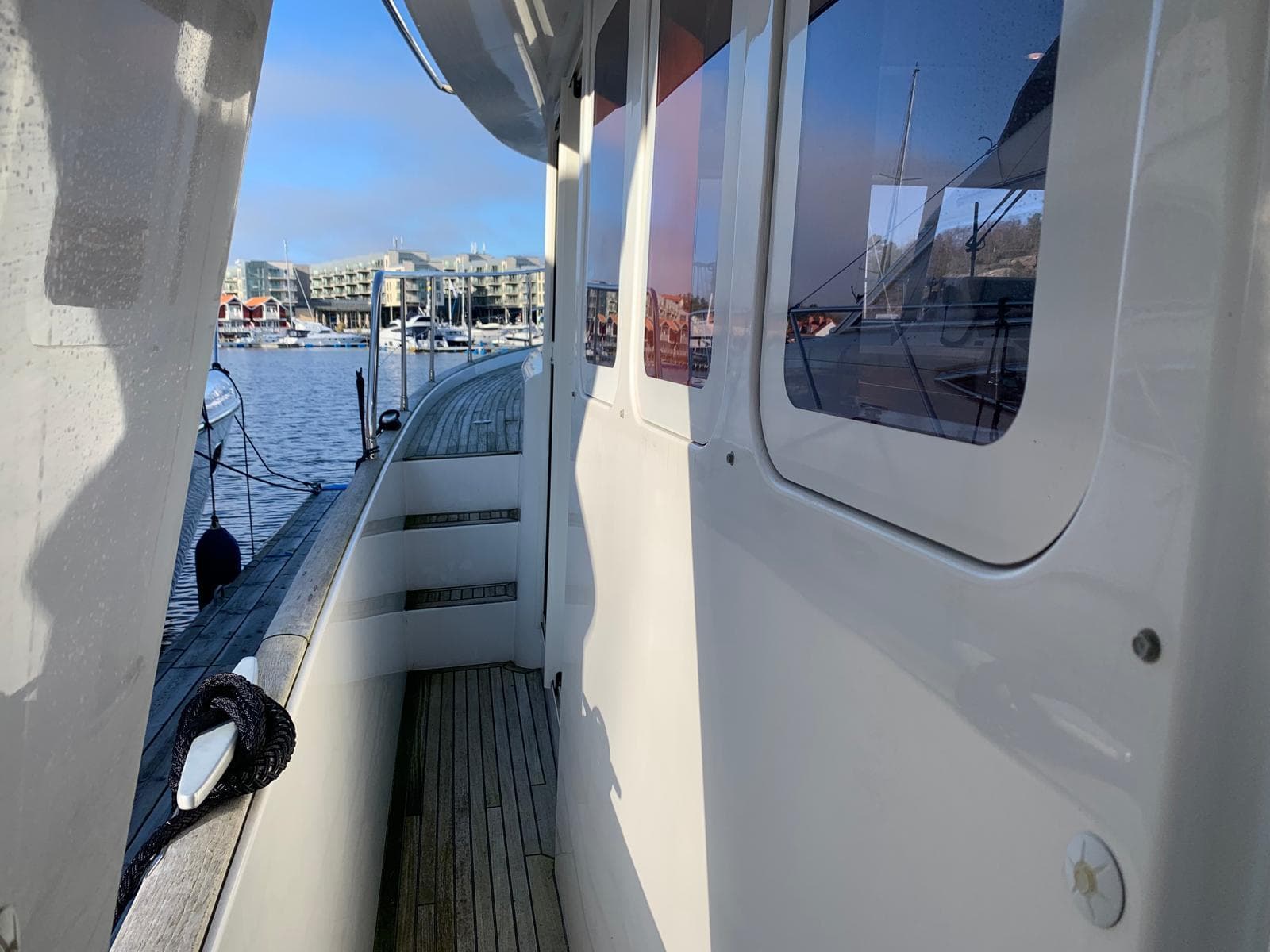 Side deck view of a 2007 Beneteau Swift Trawler 42 at a marina.