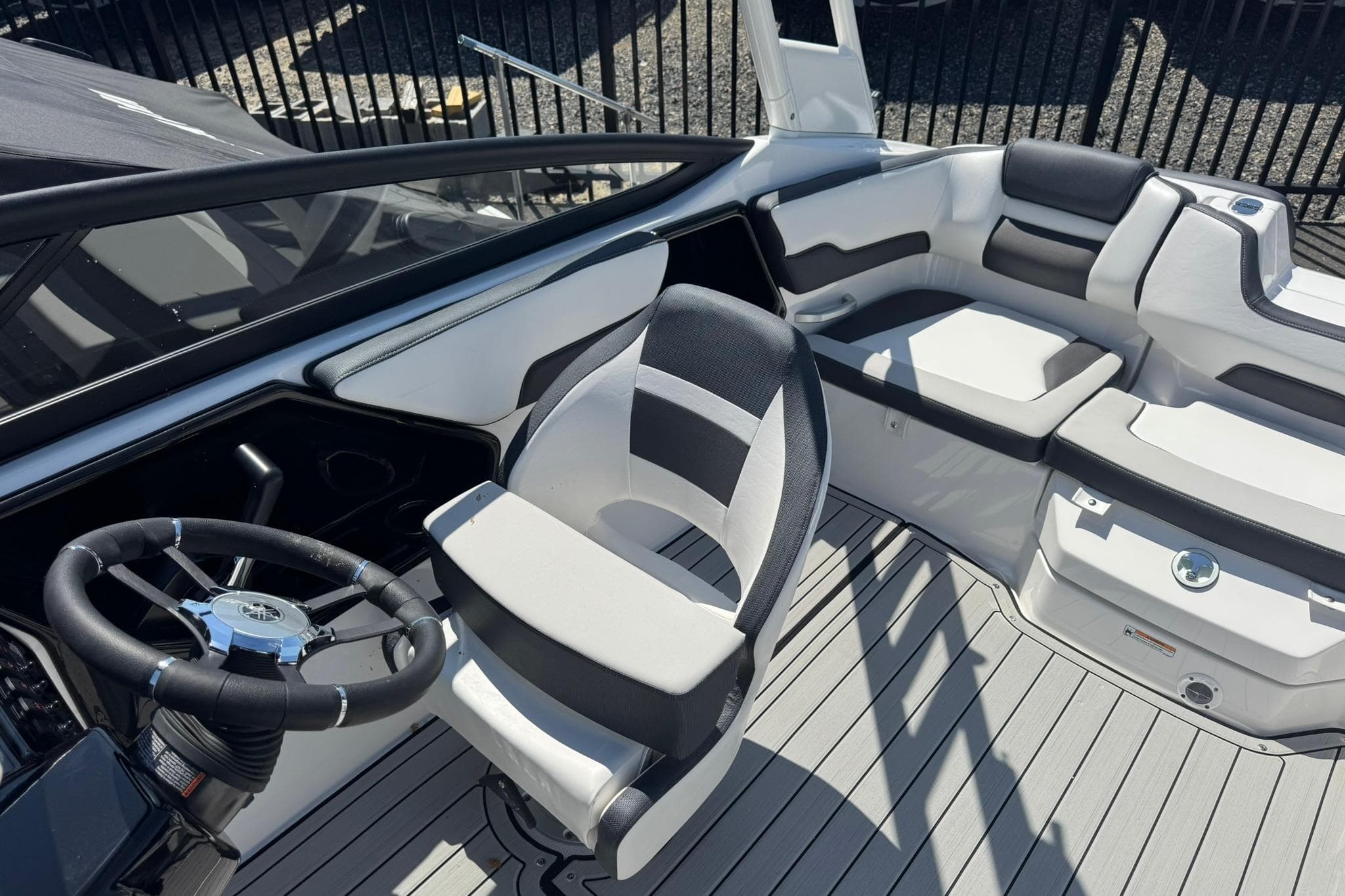 2026 Yamaha Boats 195S interior with sleek seating and modern steering wheel design.
