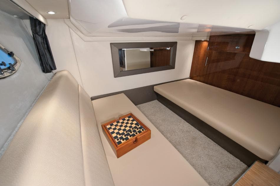 Interior of 2014 Regal 35 Sport Coupe with chessboard on beige seating.