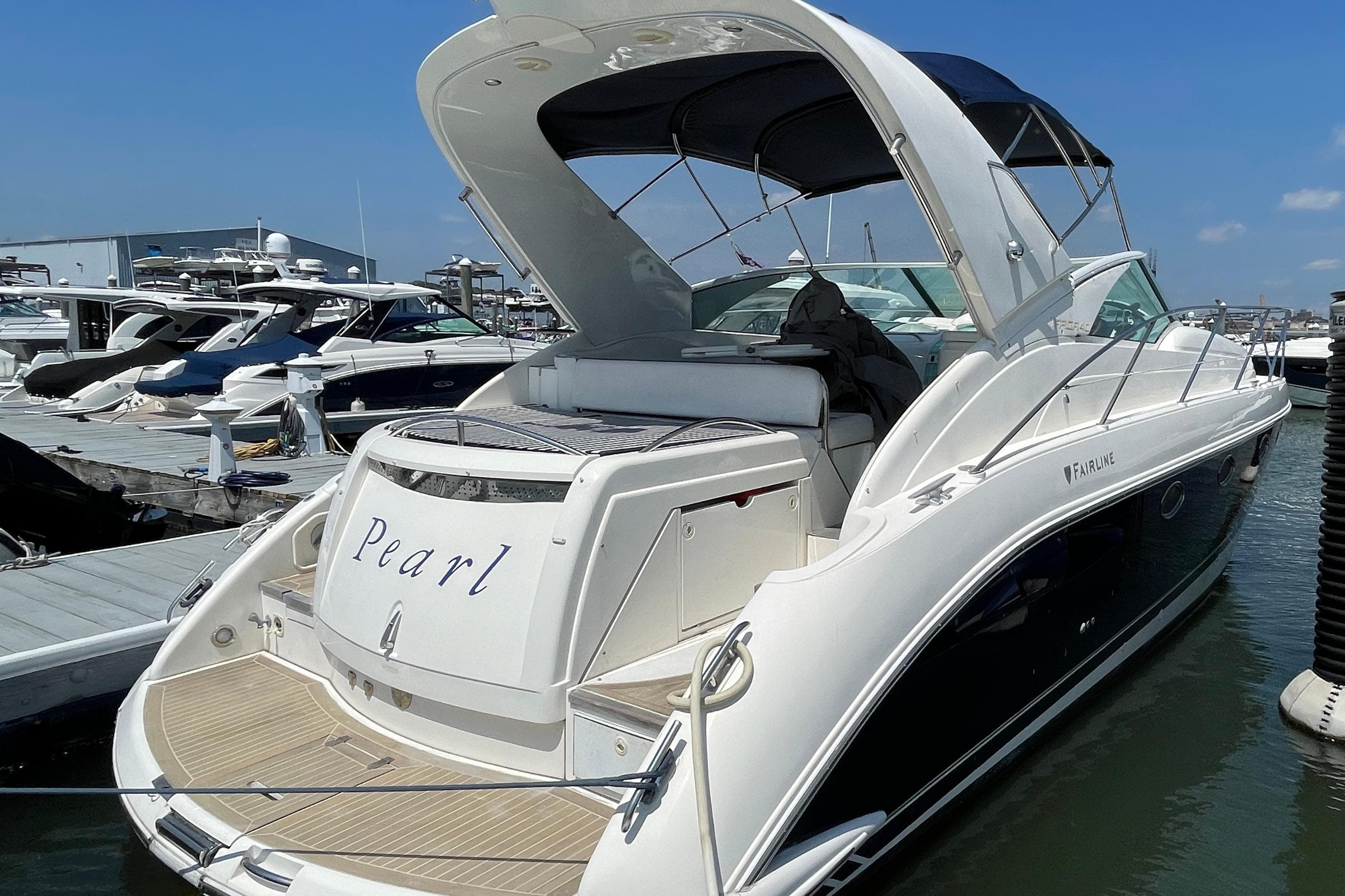 2004 Fairline Targa 40 yacht named "Pearl" docked at a marina.