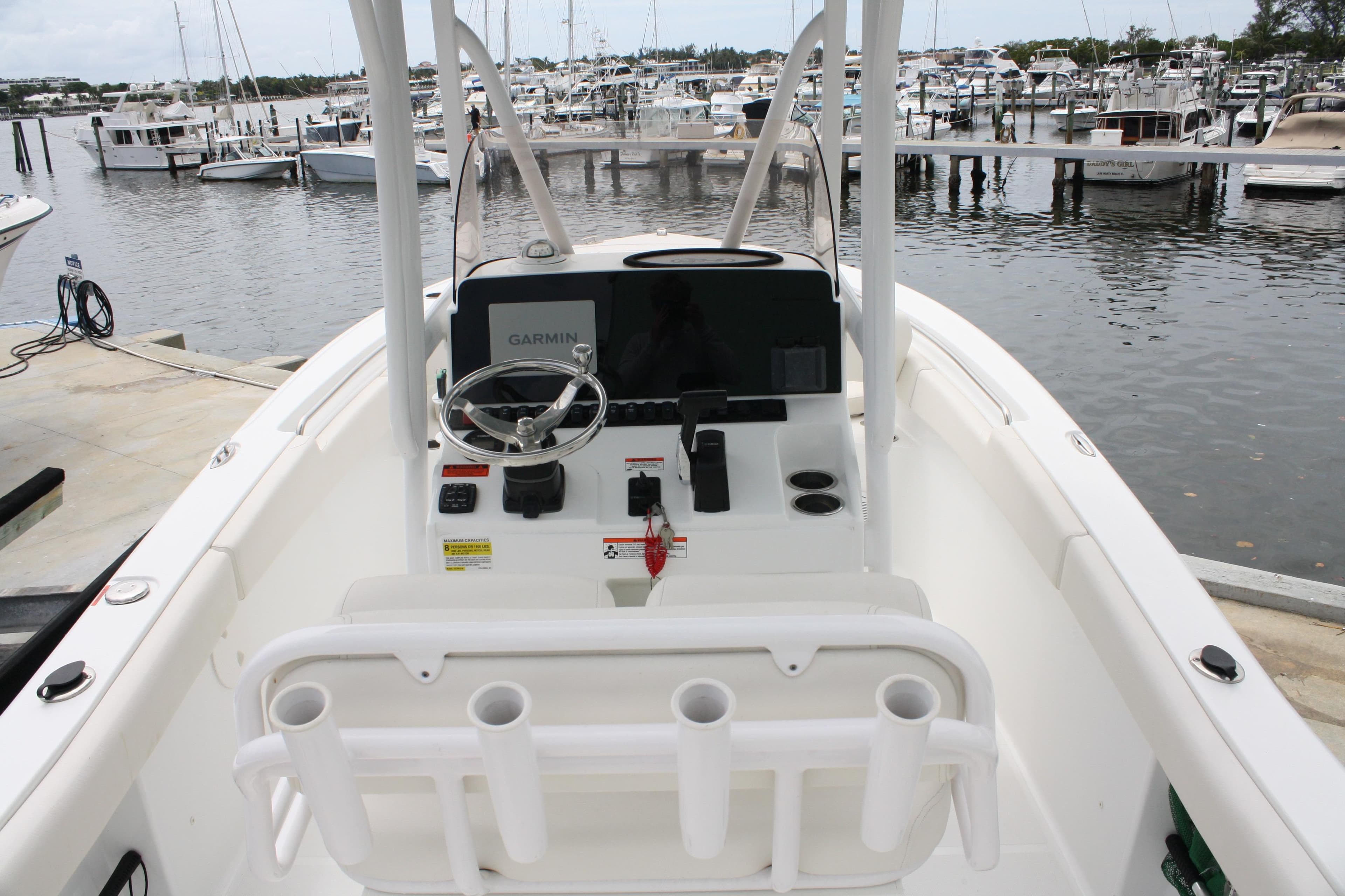 2022 Sea Hunt Ultra 219 boat interior with Garmin navigation, docked at marina.