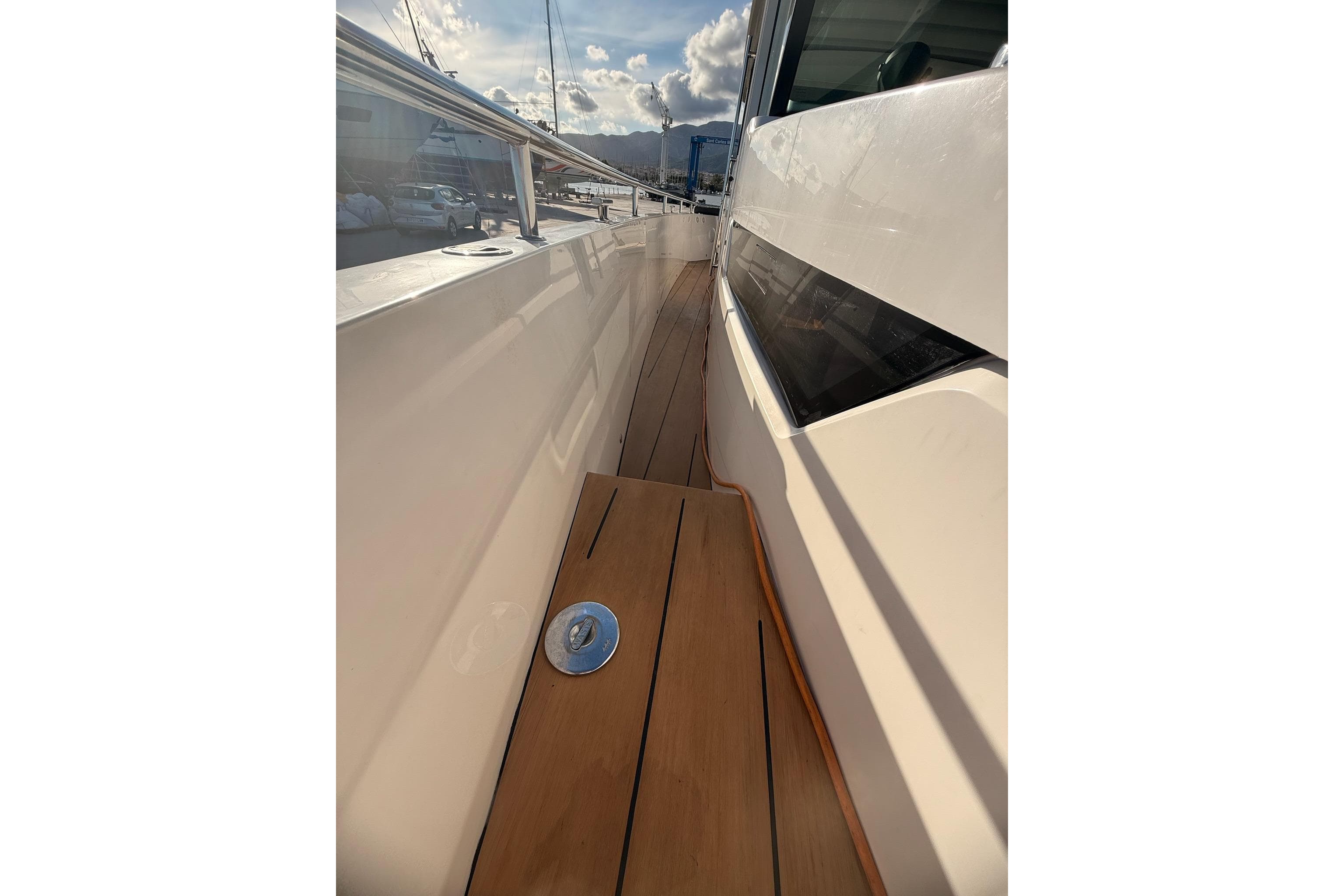 Side deck view of 2016 Axopar 37 XC CROSS CABIN with teak flooring.