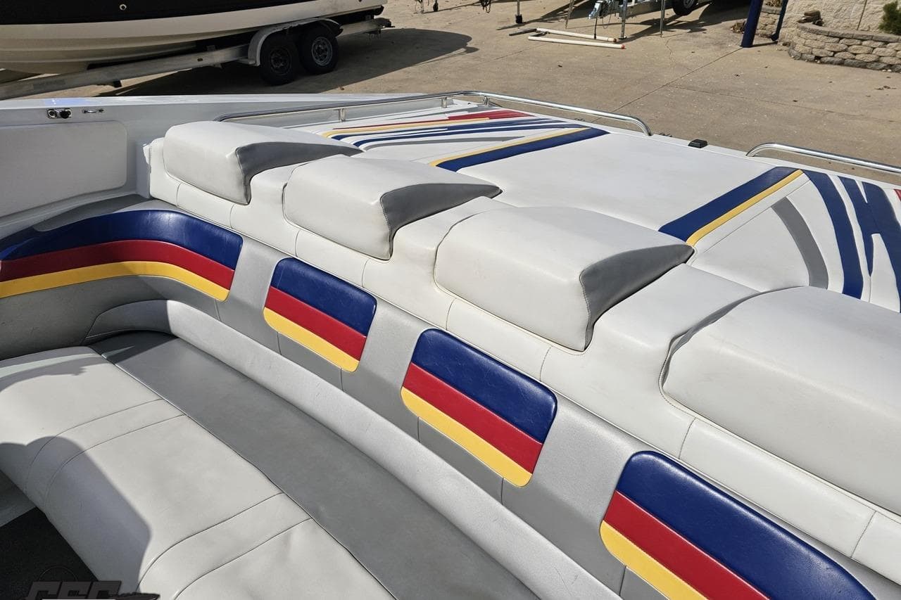2008 Formula 271 FASTech boat interior with colorful seating design.
