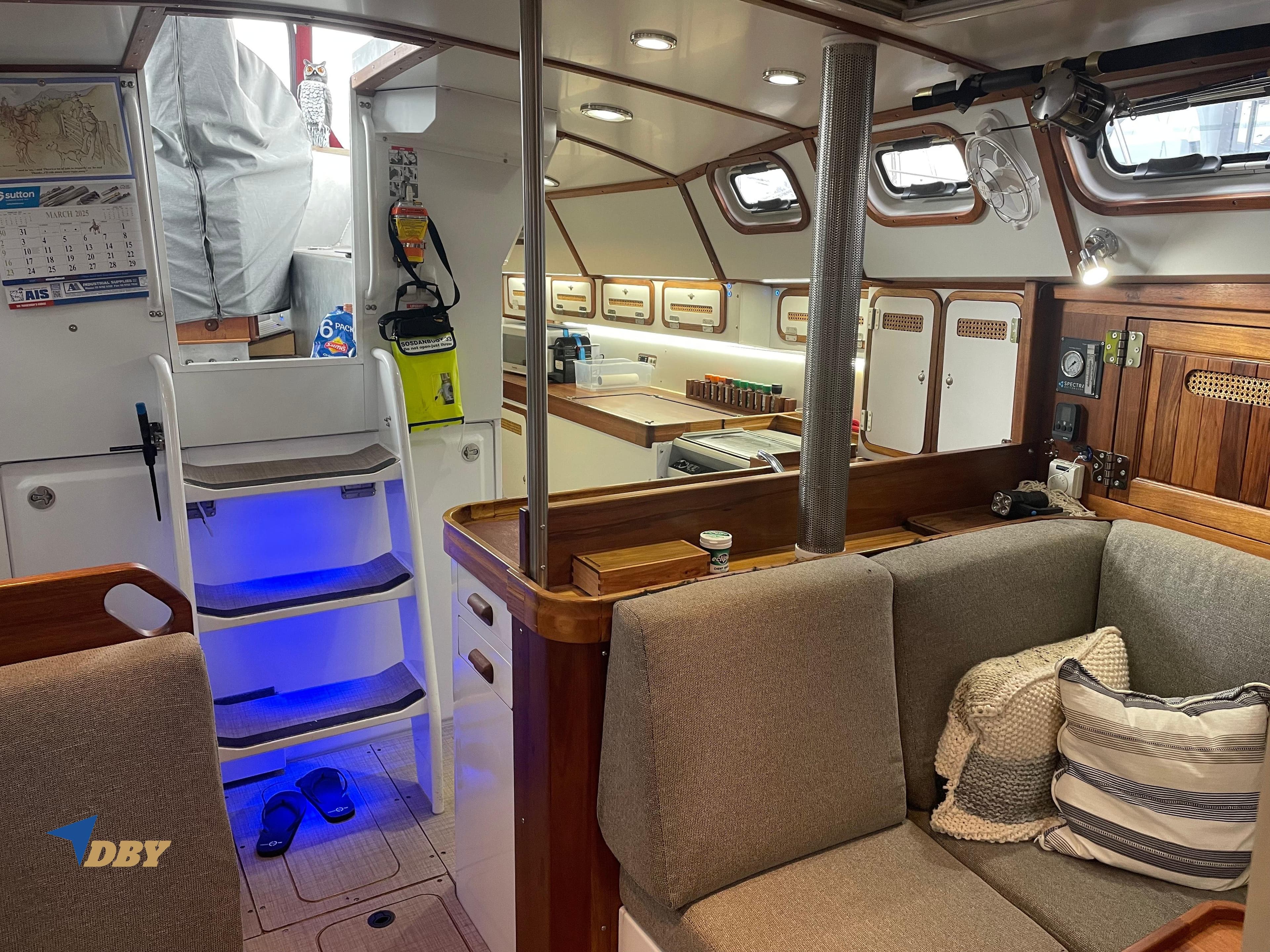 Cozy interior of 2022 Radford 15.2 yacht with modern kitchen and seating area.