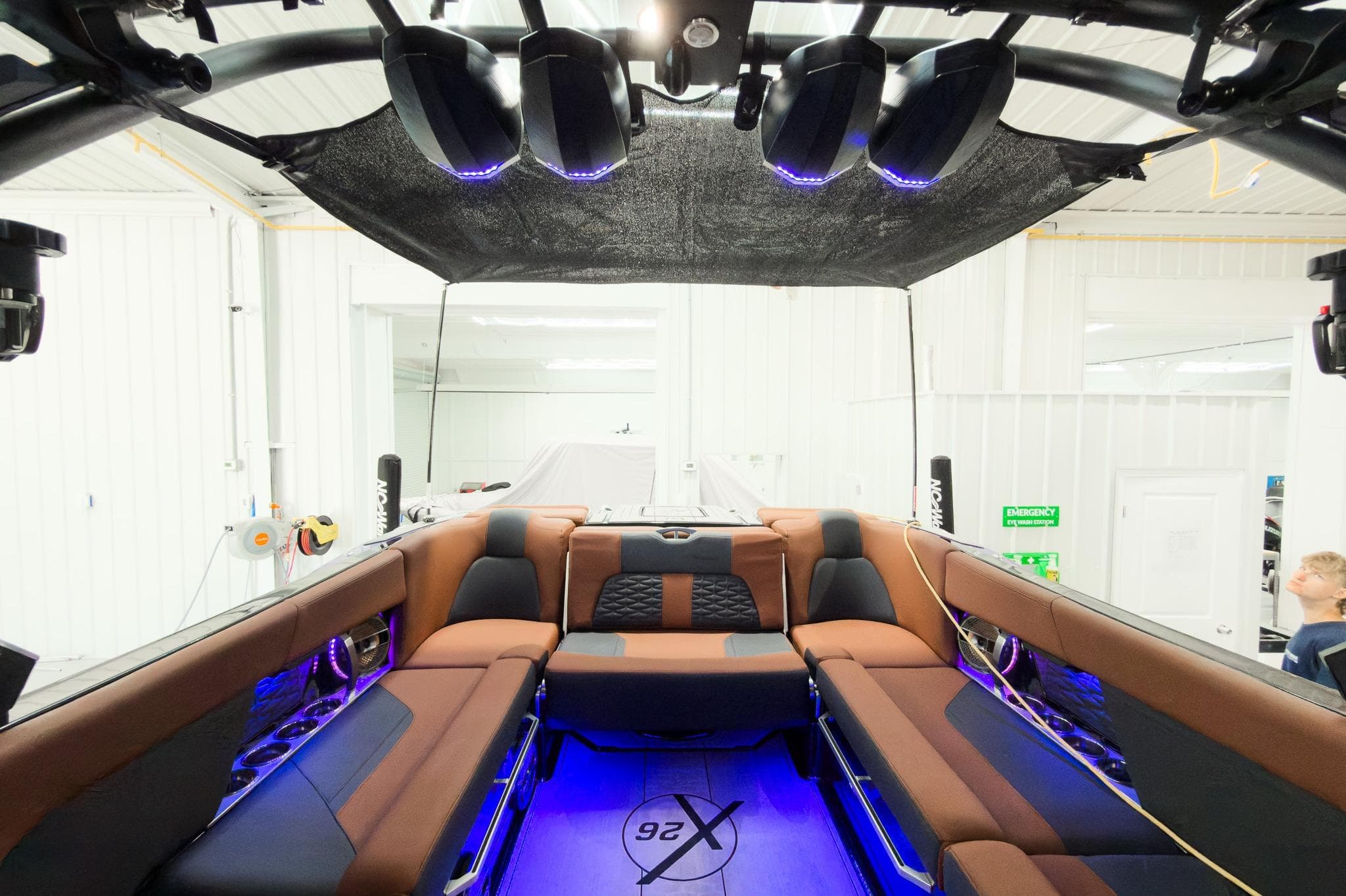 2022 MasterCraft X26 boat interior with luxurious seating and ambient lighting.