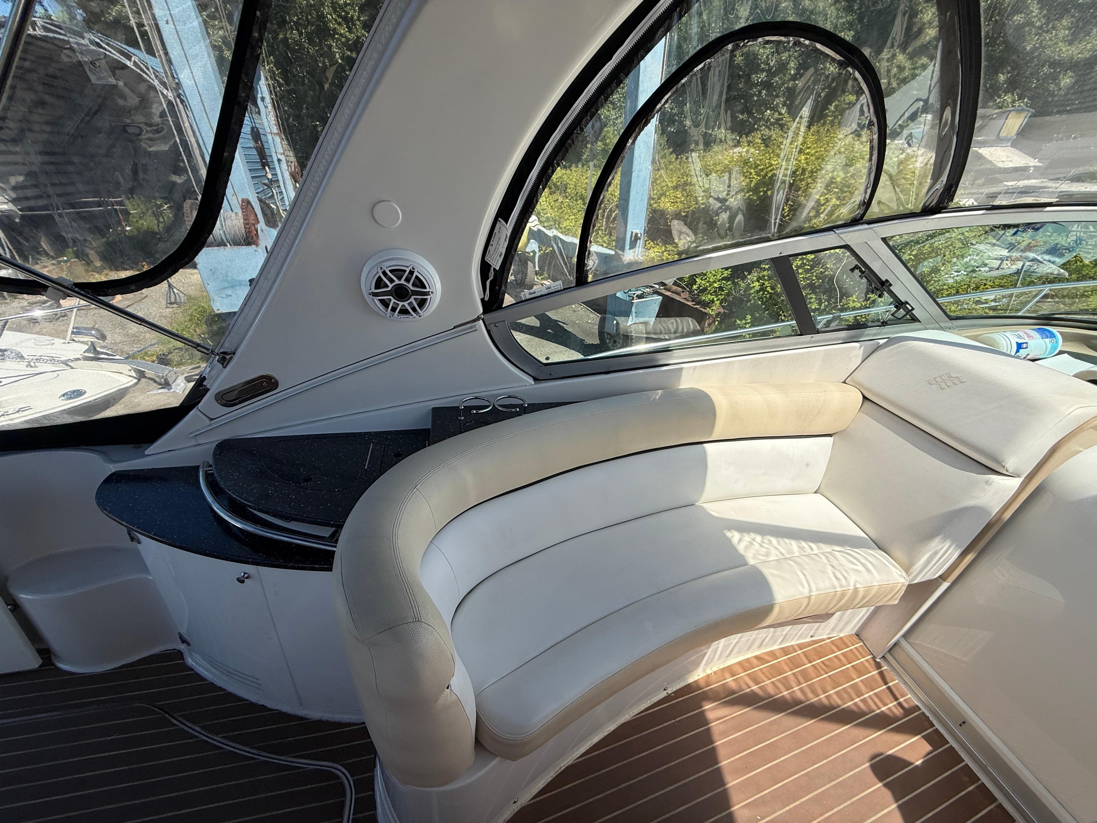 2008 Four Winns V358 boat interior with curved seating and sleek design.