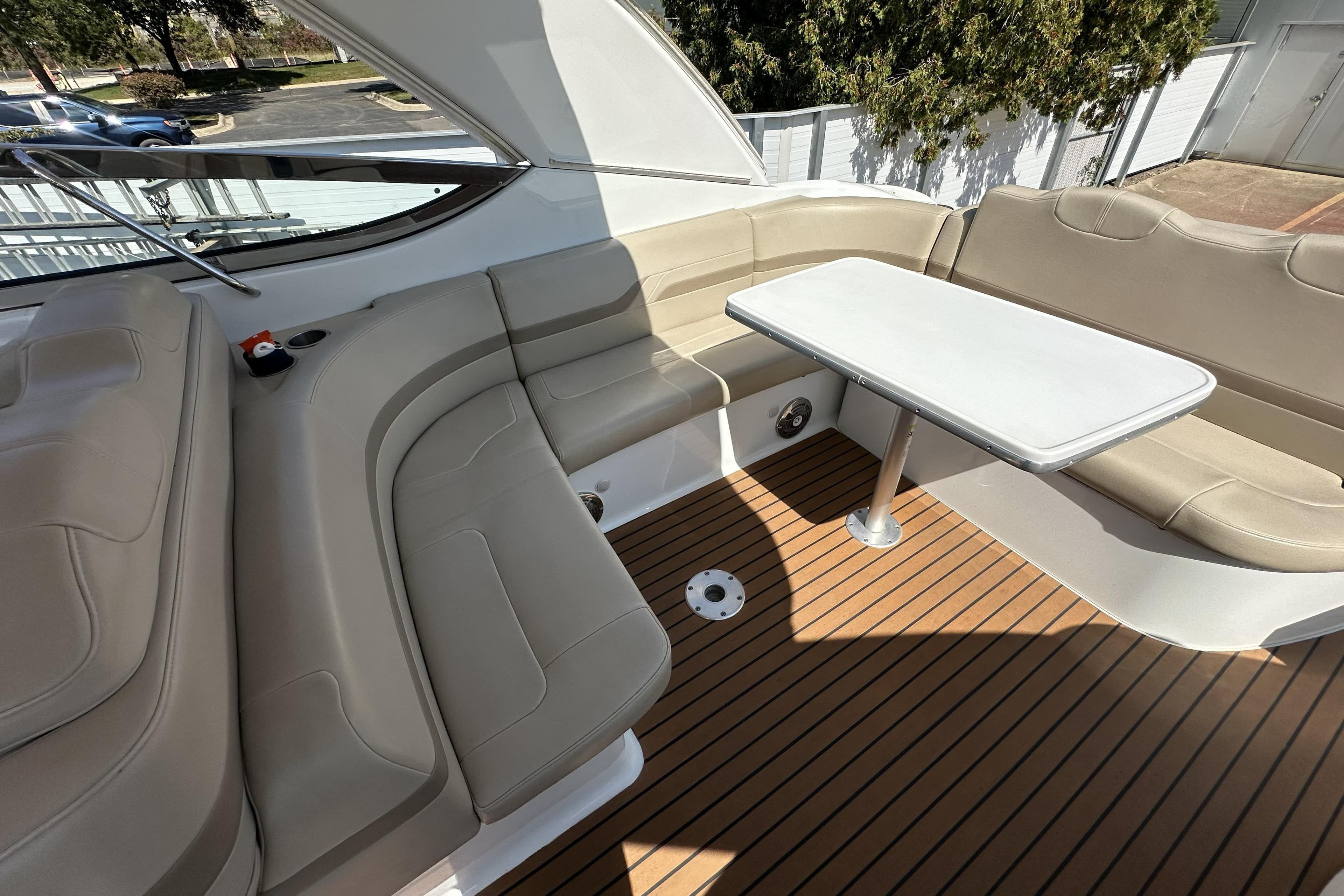 Luxurious seating area on 2011 Formula Yachts 40ss with sleek table and cushioned seats.