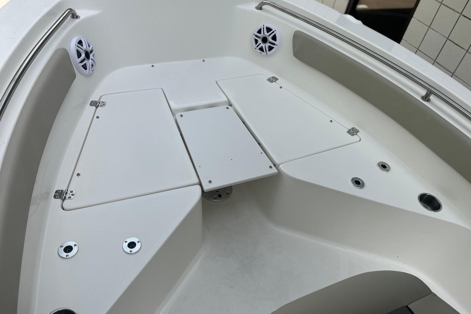 2026 Key West 189 FS boat interior with storage compartments and speakers.