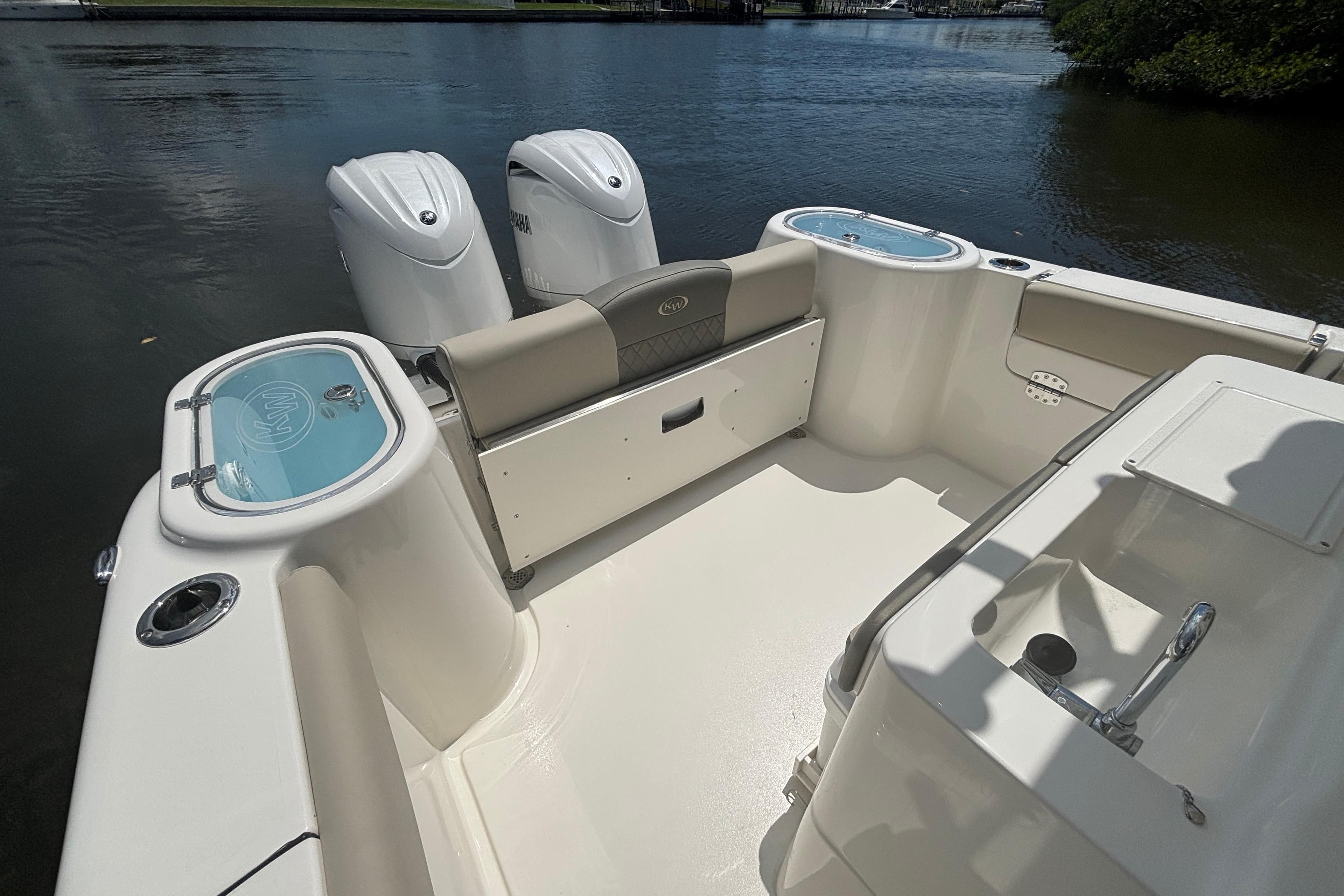 2026 Key West 260 CC boat interior with dual engines on calm water.