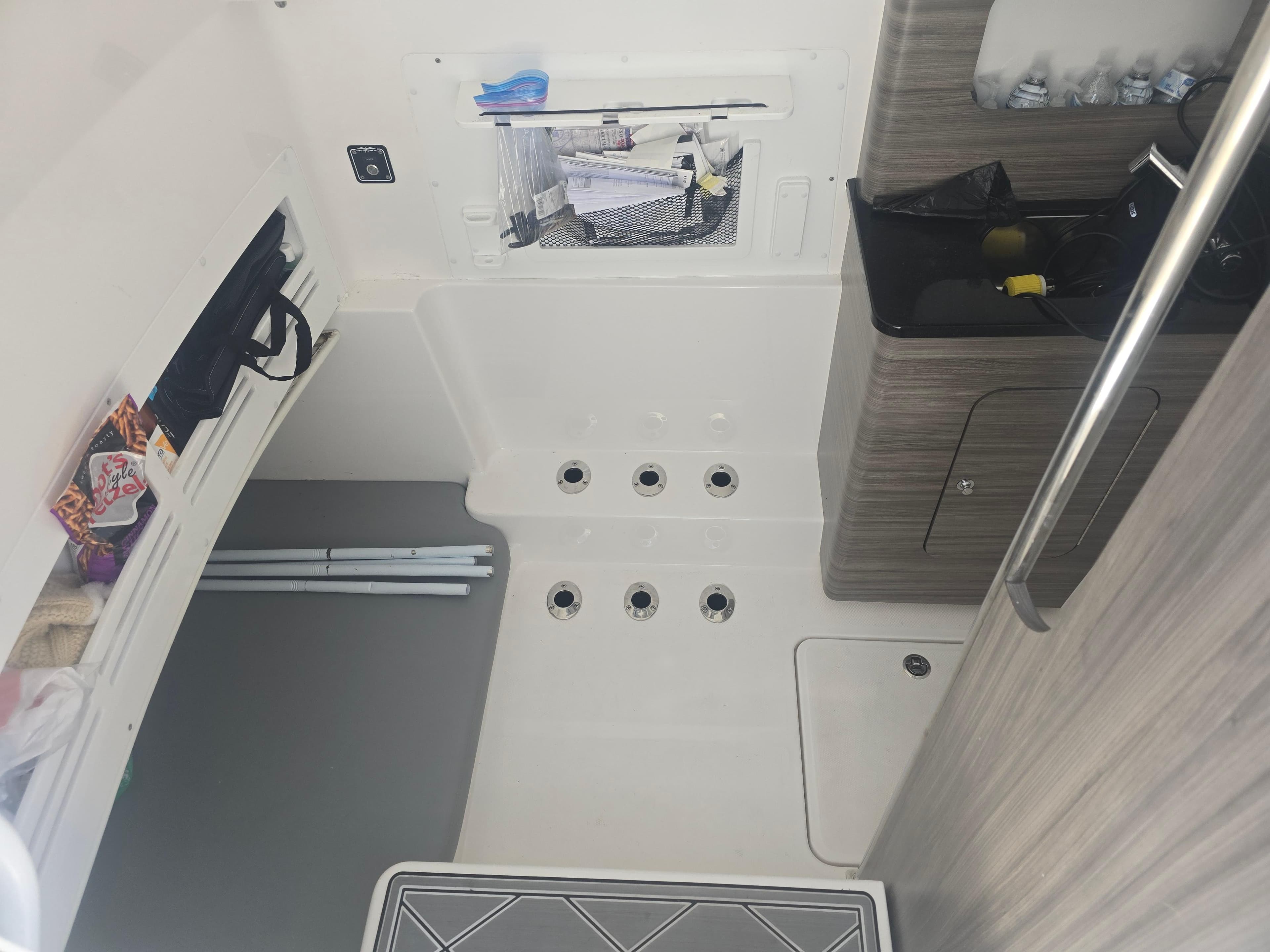 2024 Invincible 43 Open Fisherman interior with storage and sink area.