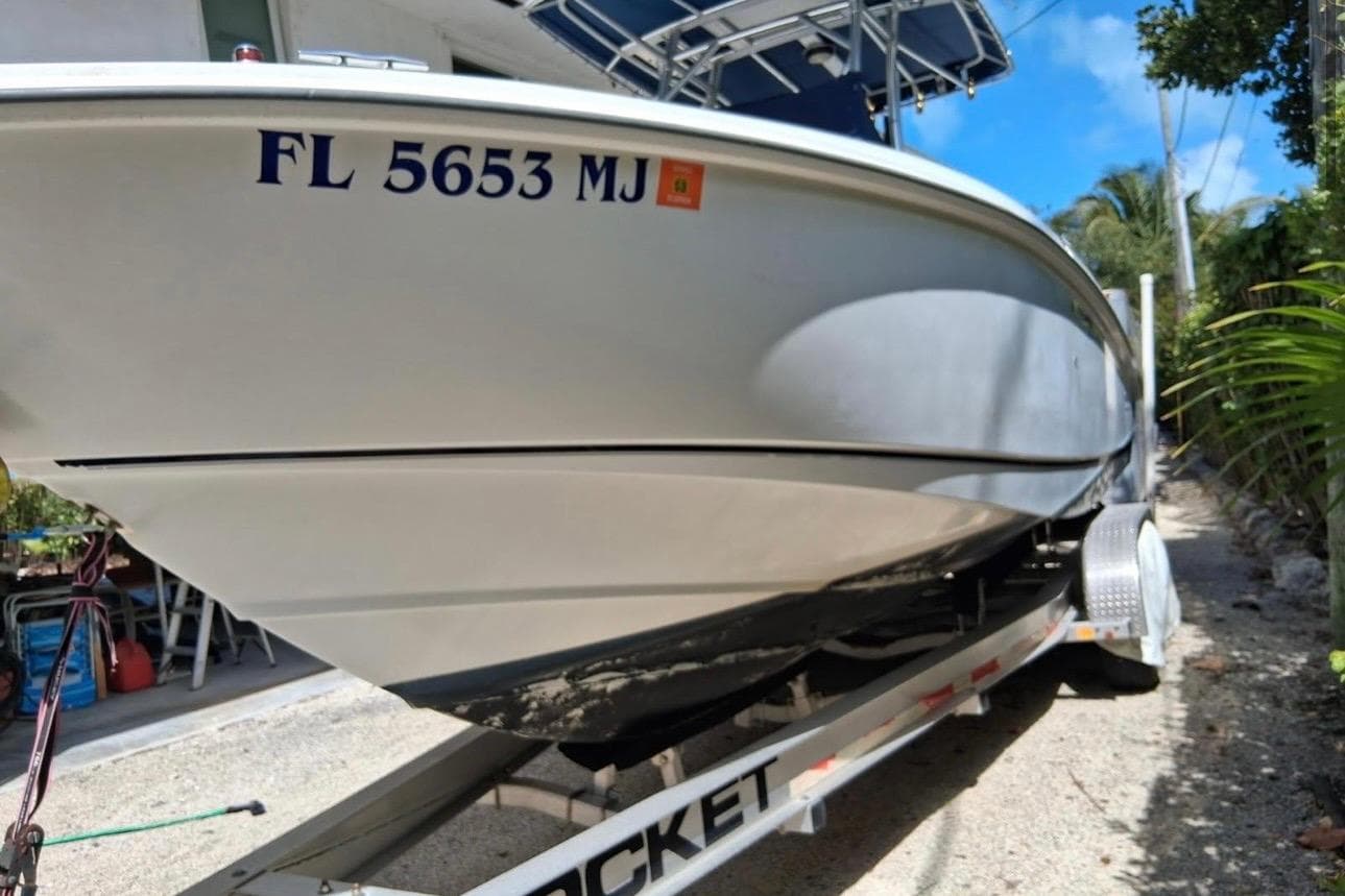 2004 Boston Whaler 270 Outrage boat on trailer, registration FL 5653 MJ.