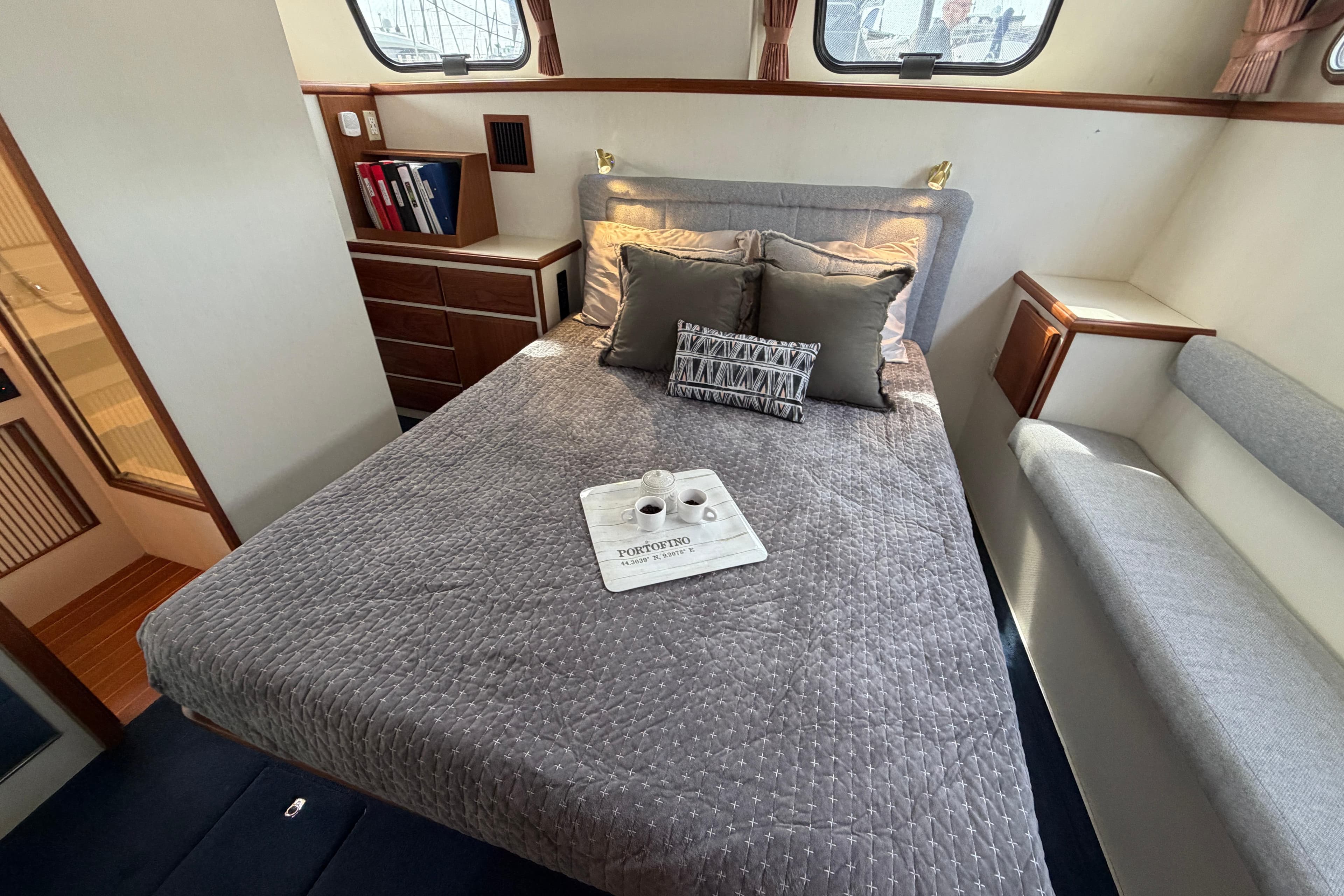 Cozy bedroom in 1994 Tollycraft 45 Cockpit Motor Yacht with elegant decor.