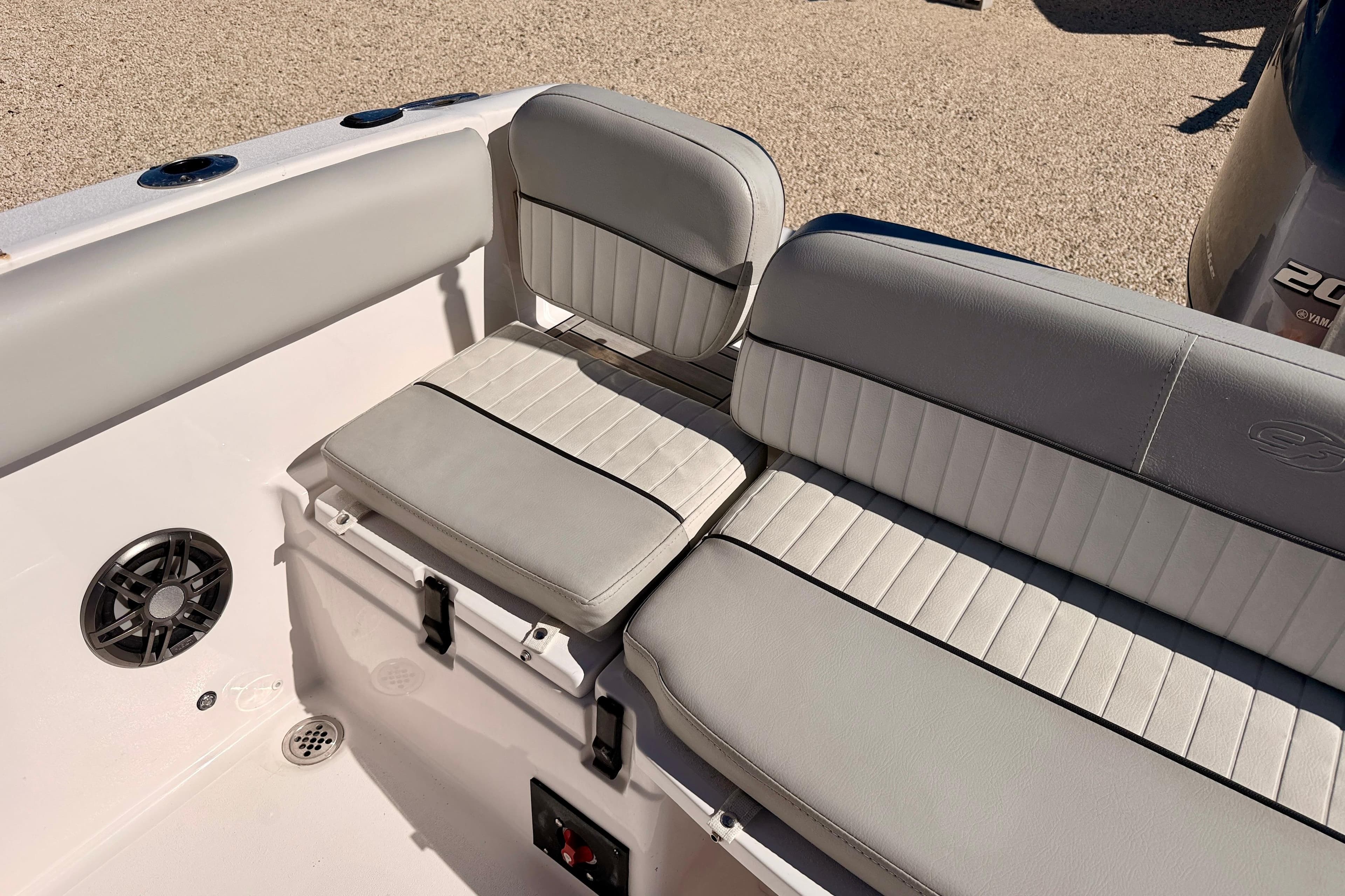 2023 Sea Fox 228 Traveler boat interior seating with gray upholstery and speaker.