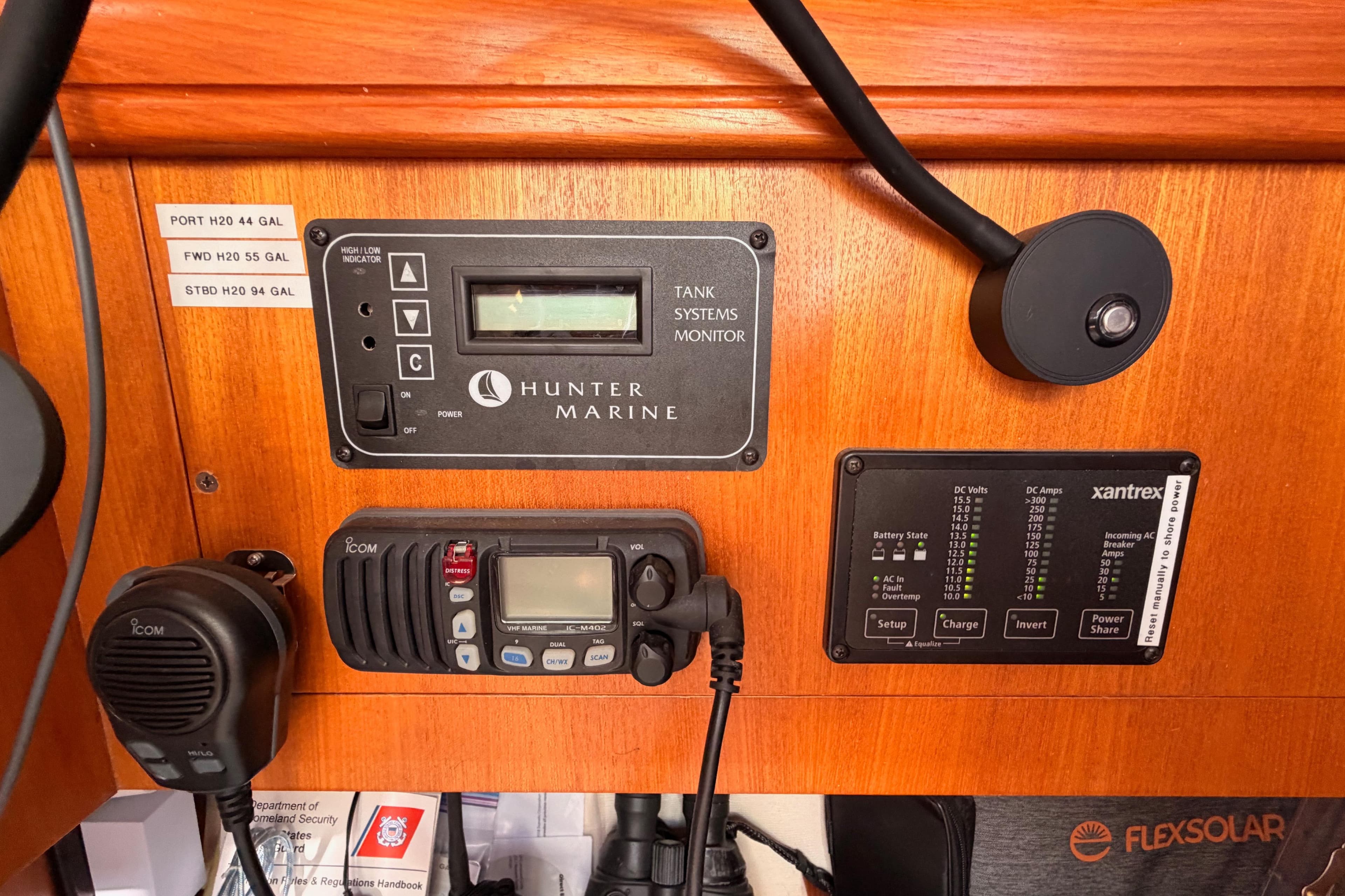 Control panel of a 2005 Hunter Passage 456 yacht with marine systems and radio.