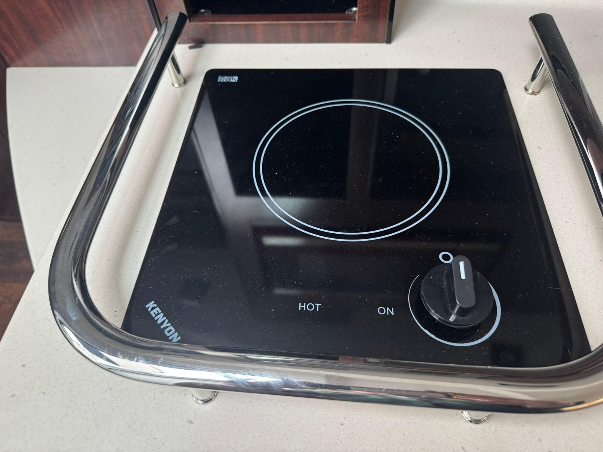 Electric stove on 2020 Monterey 295 Sport Yacht, featuring a sleek Kenyon cooktop design.
