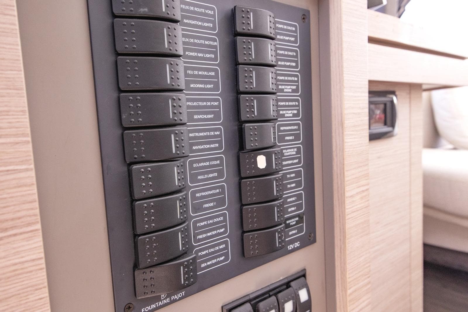 Control panel of 2023 Fountaine Pajot Astrea 42 Maestro yacht, featuring labeled switches.