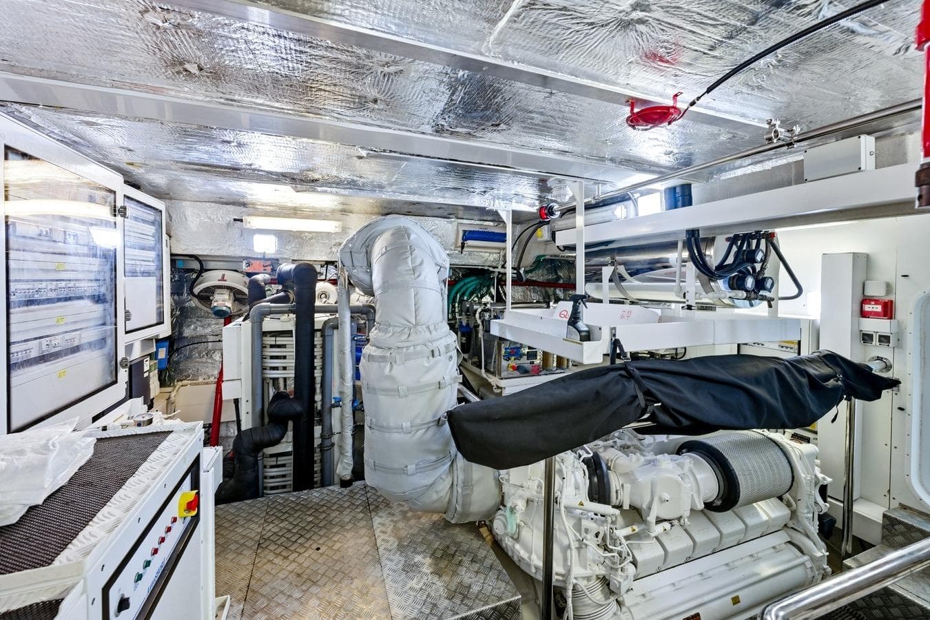 Engine room of a 2022 Sunseeker Motoryacht, featuring advanced machinery and control panels.