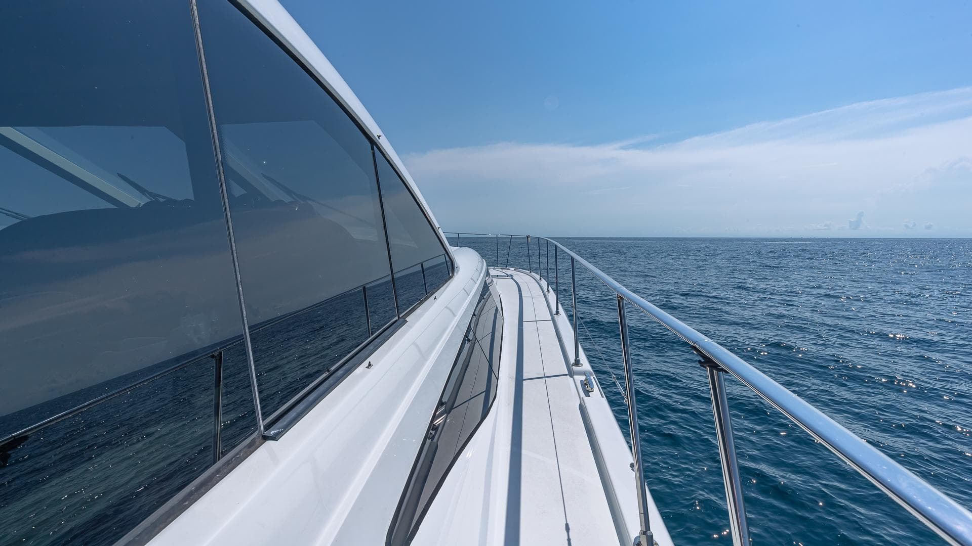 Custom 650 Catamaran 2010 cruising on open sea under clear blue sky.