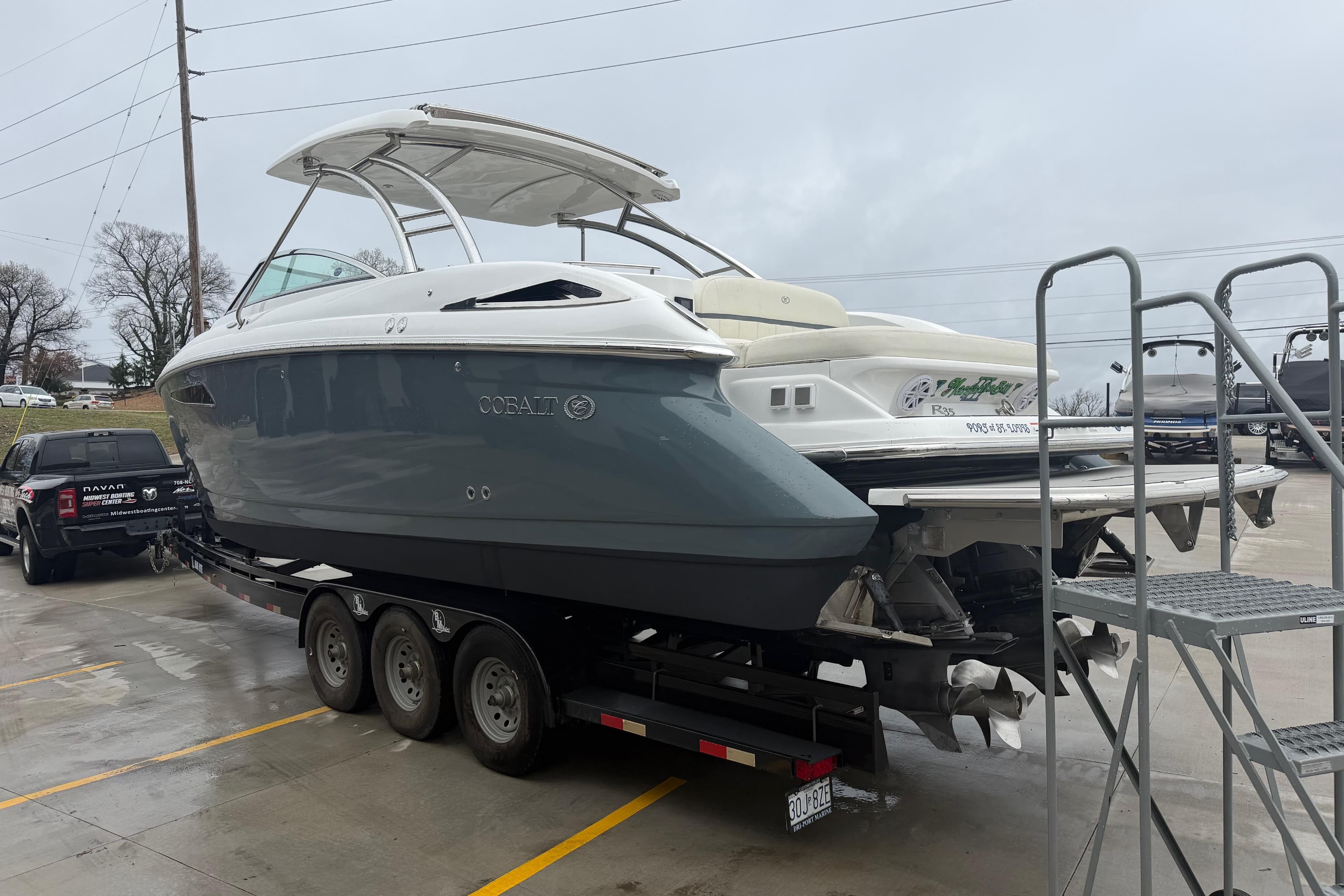 2019 Cobalt R35 boat on trailer, parked in a lot on a cloudy day.