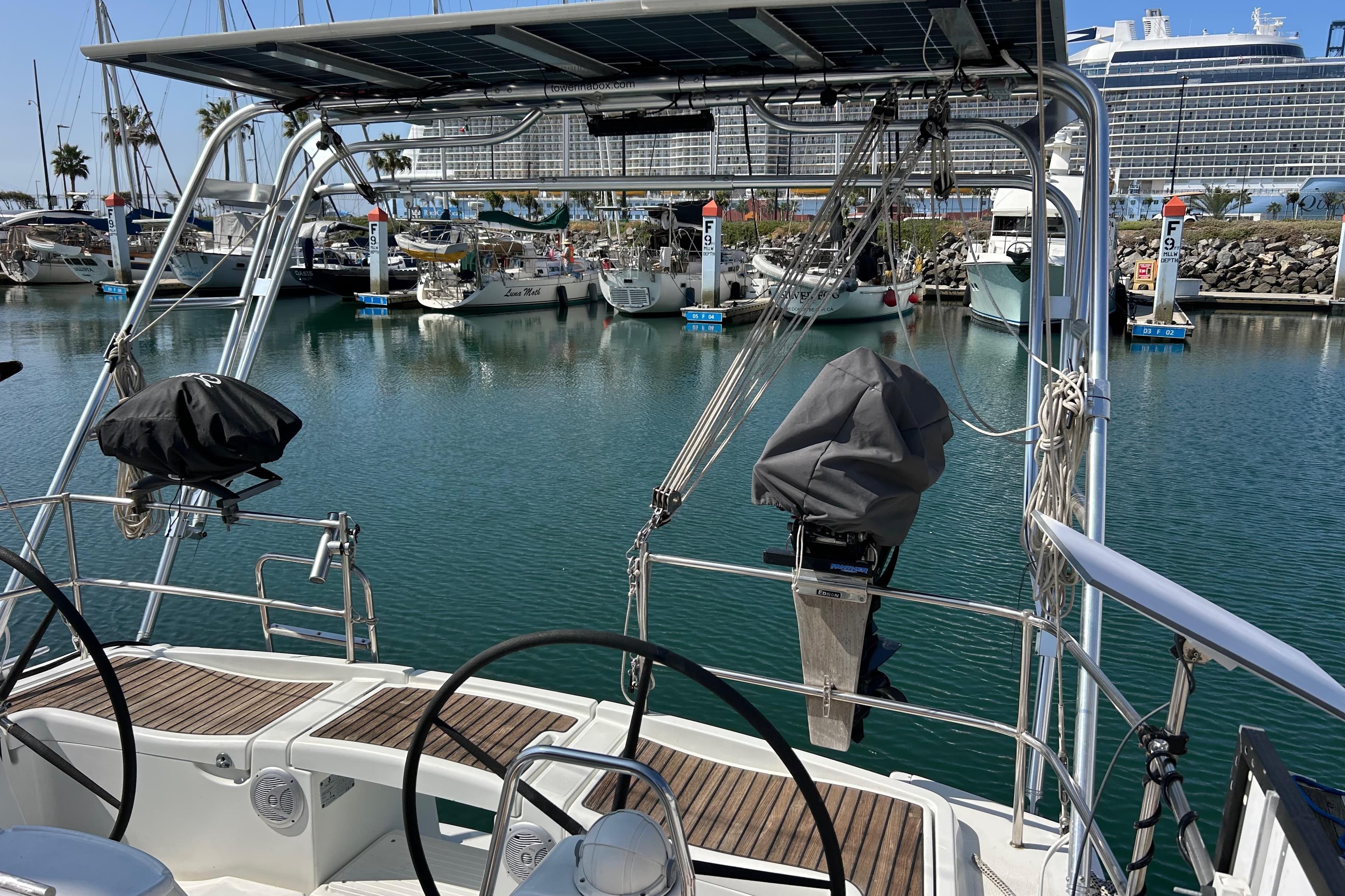 Beneteau Oceanis 43 sailboat, 2008 model, docked in a marina with clear blue water.