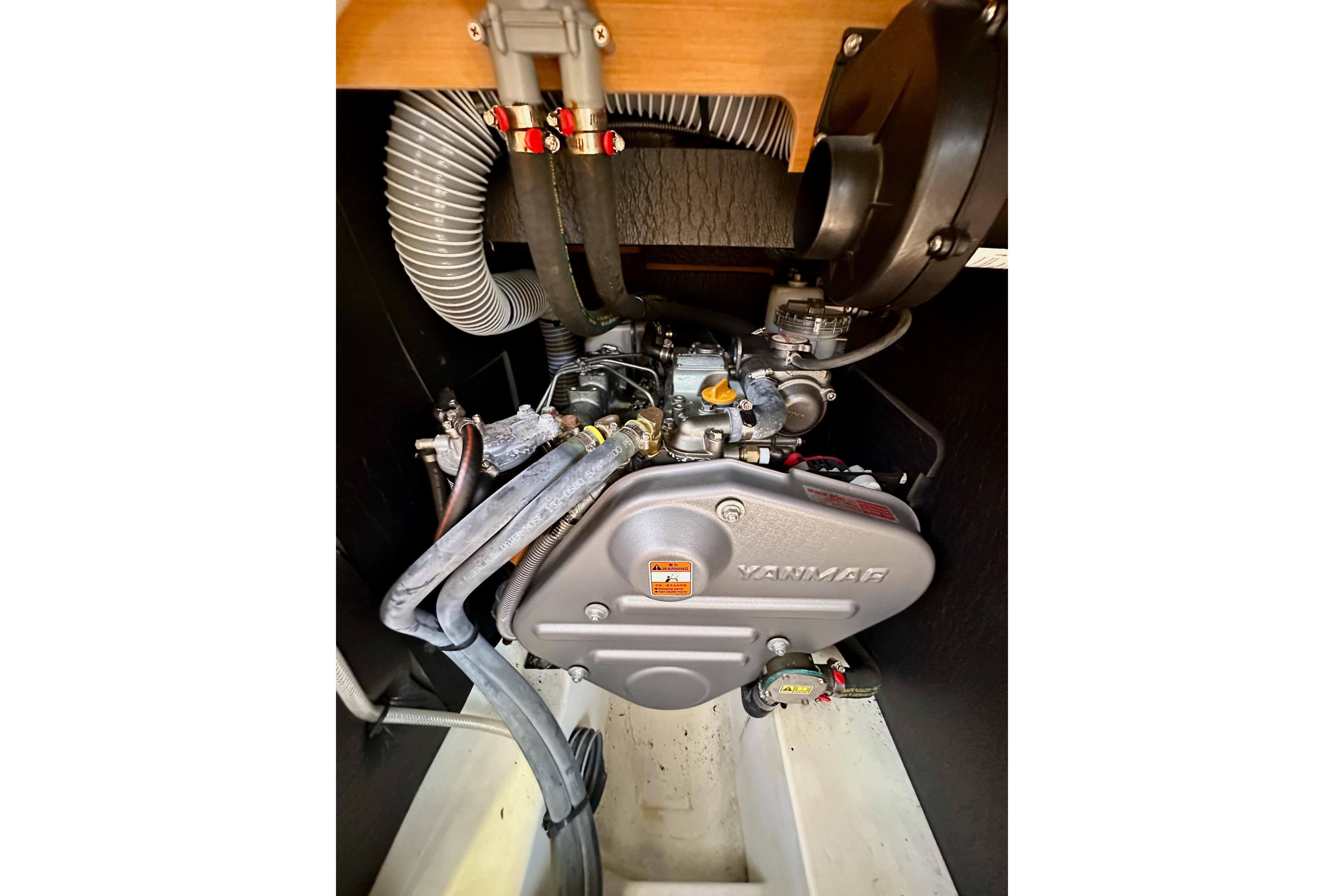 Engine compartment of 2015 Jeanneau Sun Odyssey 409 sailboat, featuring Yanmar engine.