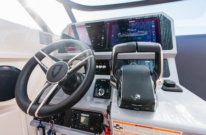 Modern Navan S30 boat dashboard with steering wheel and advanced navigation controls, 2025 model.
