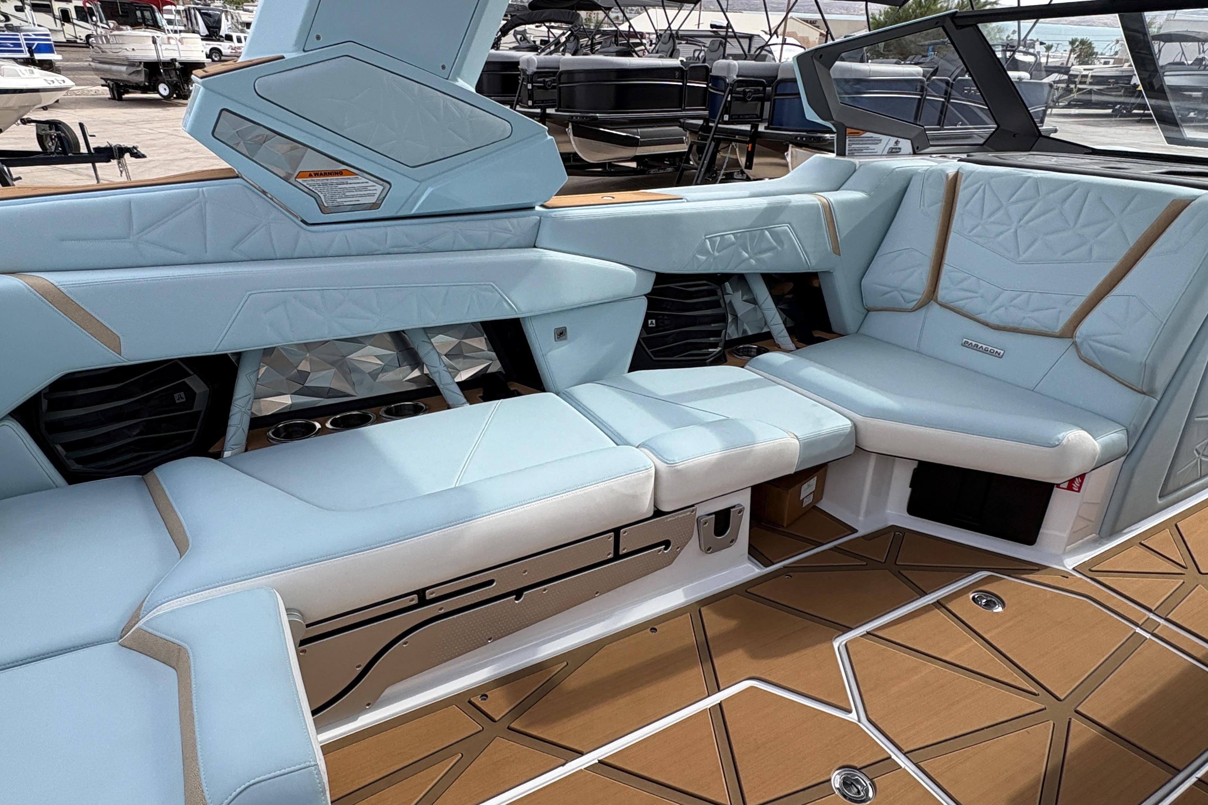 Luxurious interior of 2026 Nautique Super Air Nautique G23 Paragon with light blue seating.