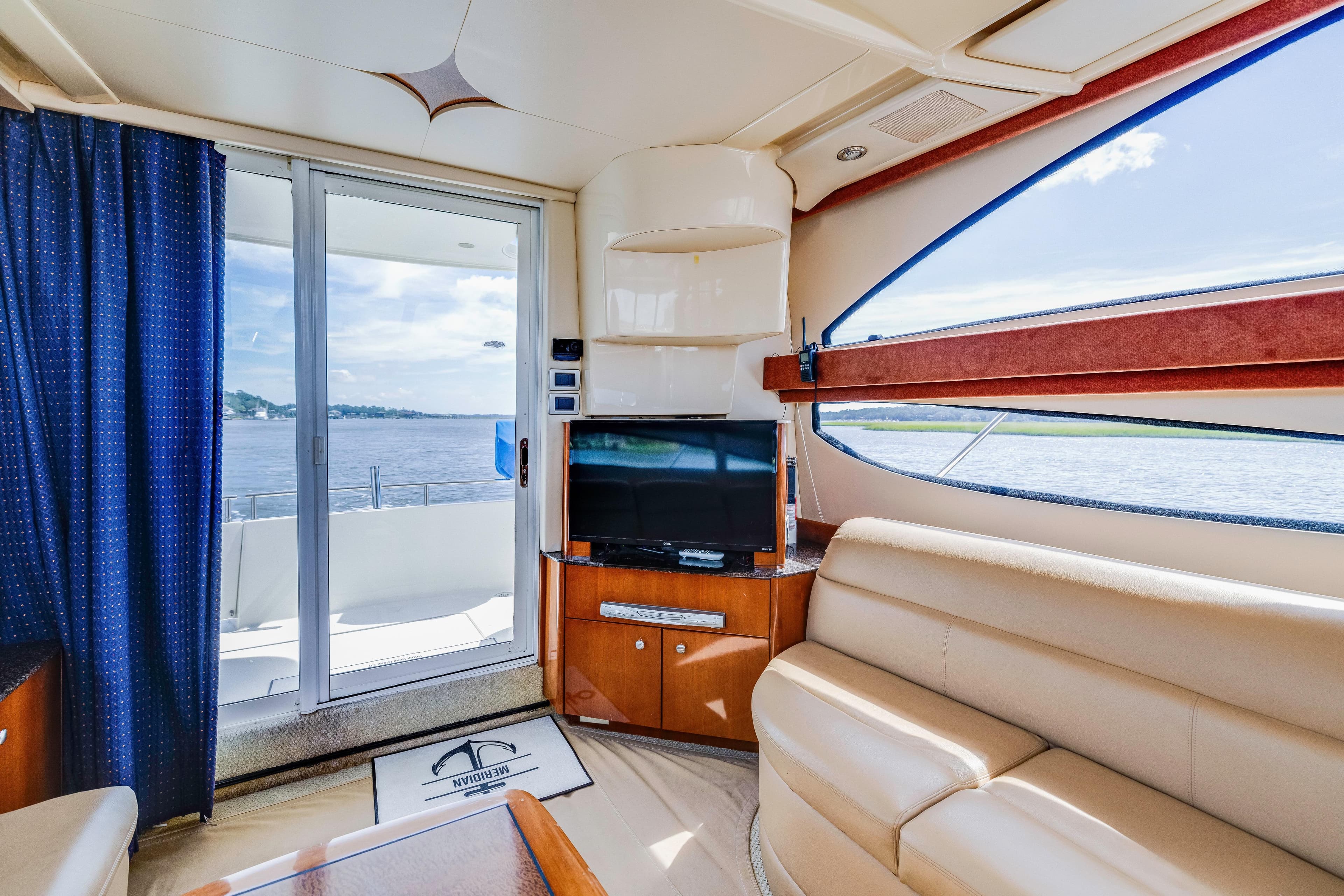 Luxurious interior of 2006 Meridian 341 Sedan yacht with scenic water view.