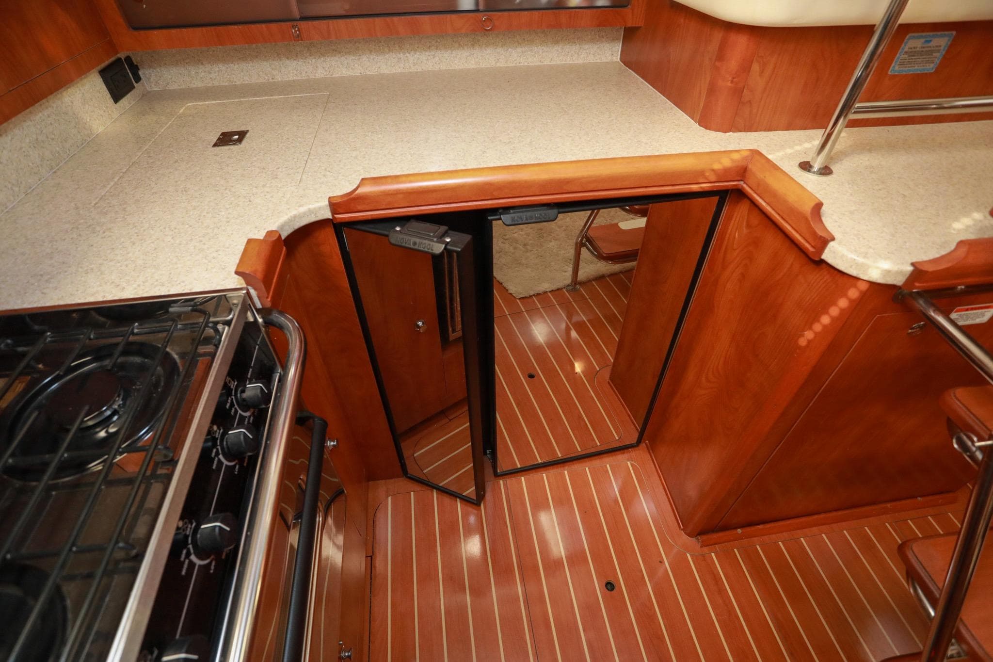 2009 Hunter 45 Center Cockpit interior with wood flooring and modern kitchen amenities.