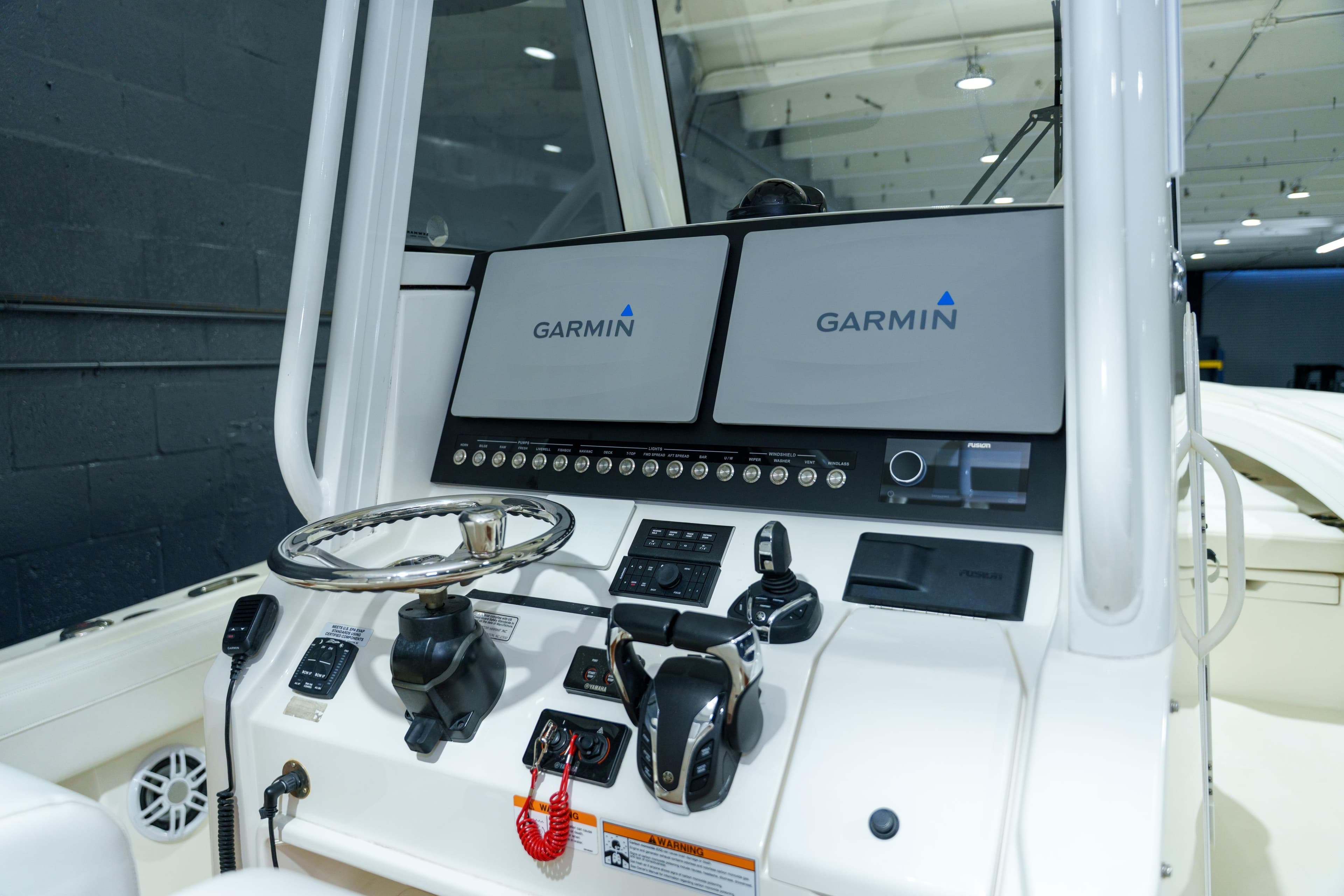 2023 Regulator 28 boat dashboard with Garmin navigation displays and controls.
