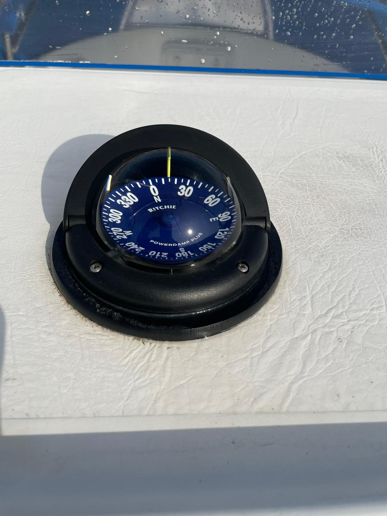 Compass on 2000 Edgewater 247CC boat dashboard, displaying navigation degrees.