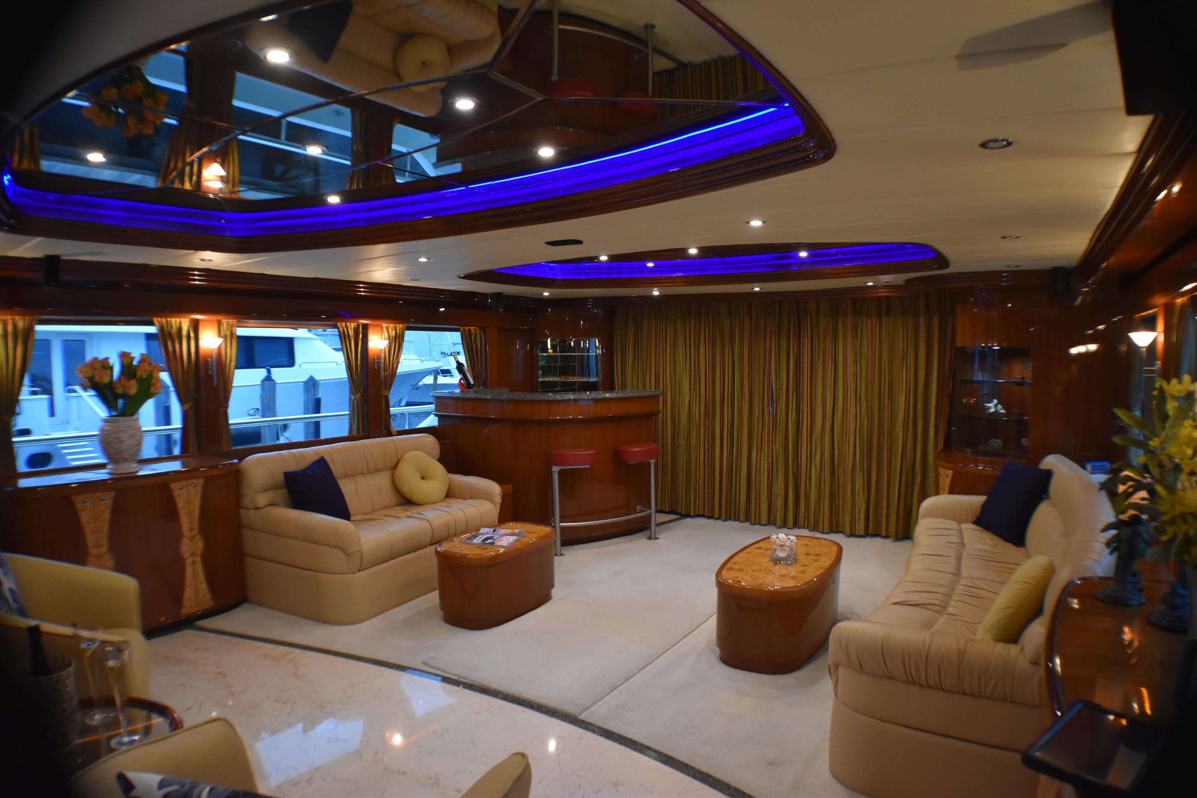 Luxurious yacht interior with plush seating, bar area, and ambient lighting, Johnson Country Kitchen 2006.