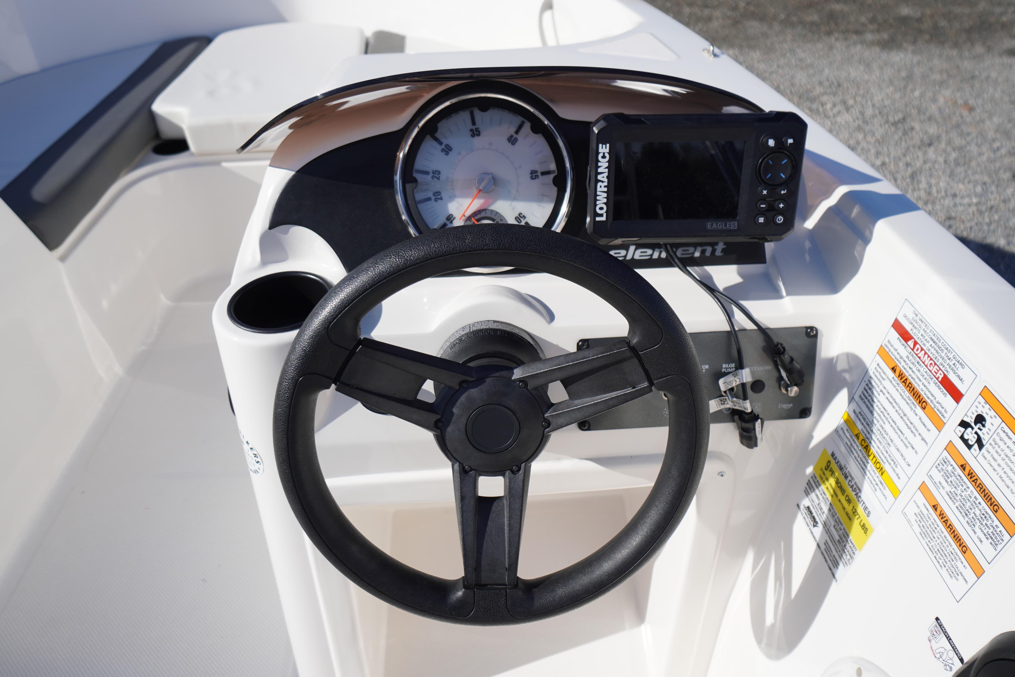 2024 Bayliner Element E18 dashboard with steering wheel and navigation system.