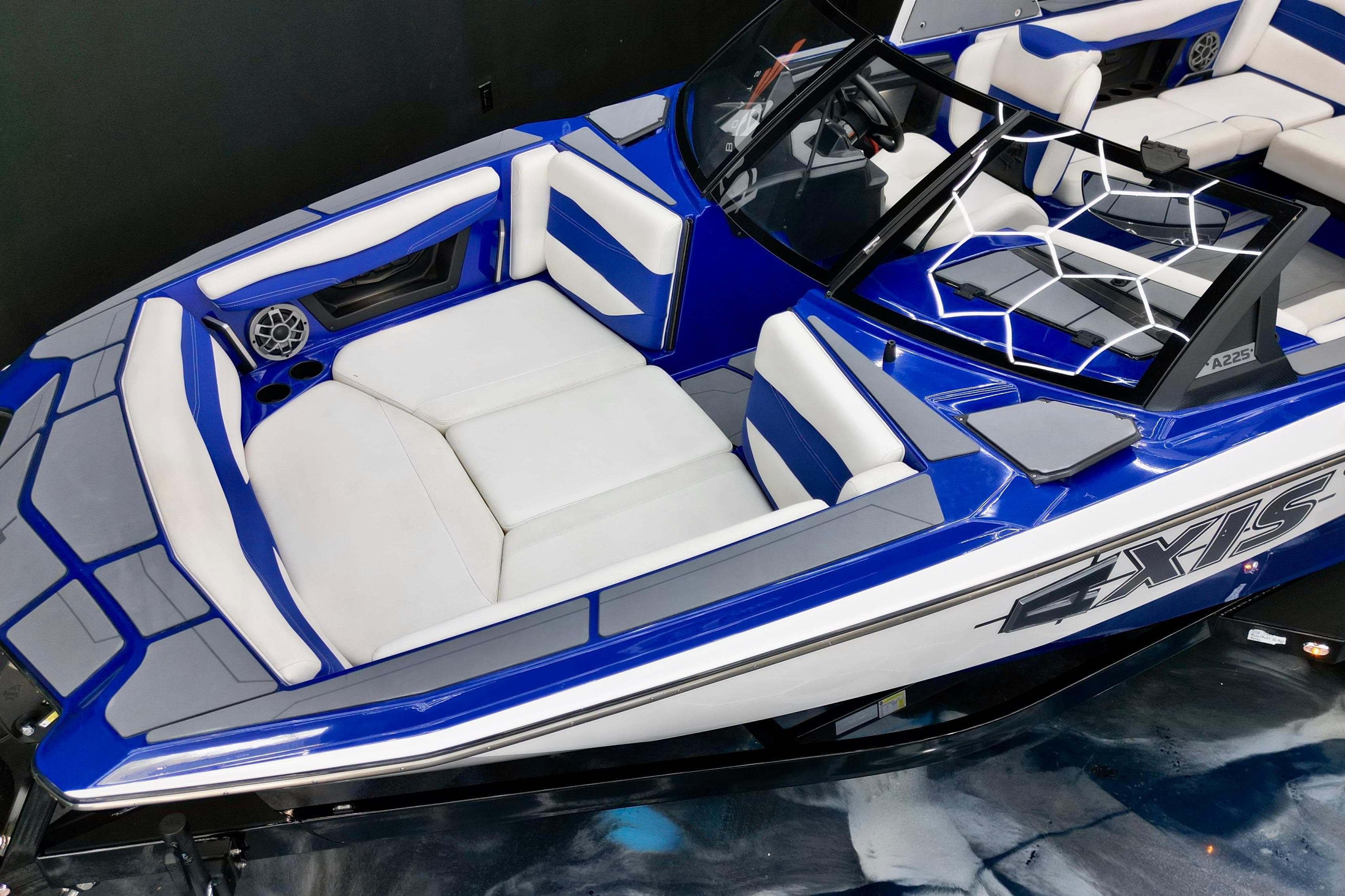 2023 Axis A225 boat interior with blue and white seating, sleek design, and modern features.