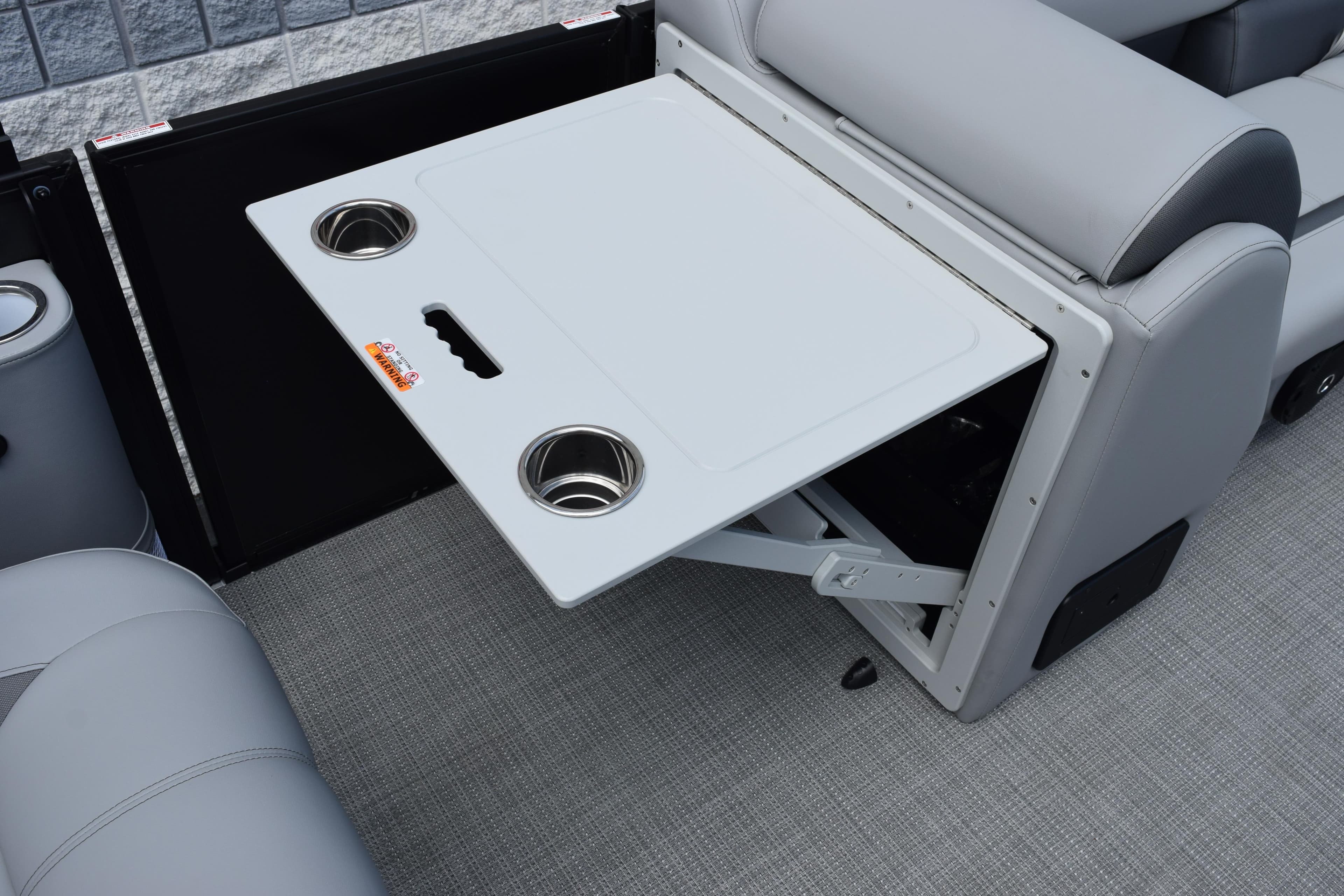 2026 Bentley Pontoons Legacy 243 Swingback interior with foldable table and cup holders.