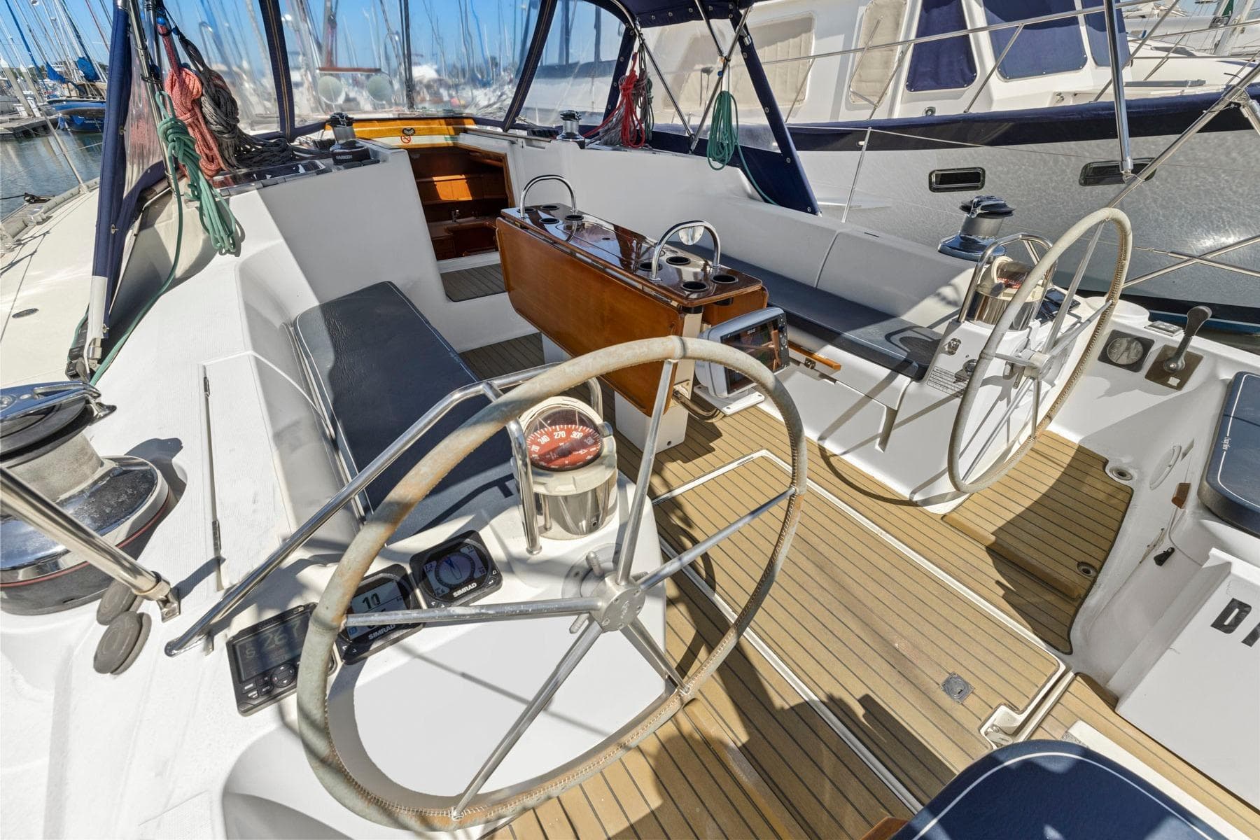 Cockpit of 2001 Jeanneau Sun Odyssey 52.2 sailboat with dual steering wheels.