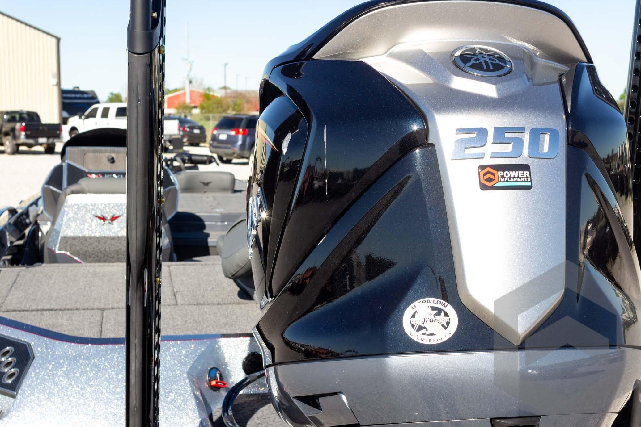 2026 Vexus VXs21 boat with powerful 250 engine, parked outdoors.