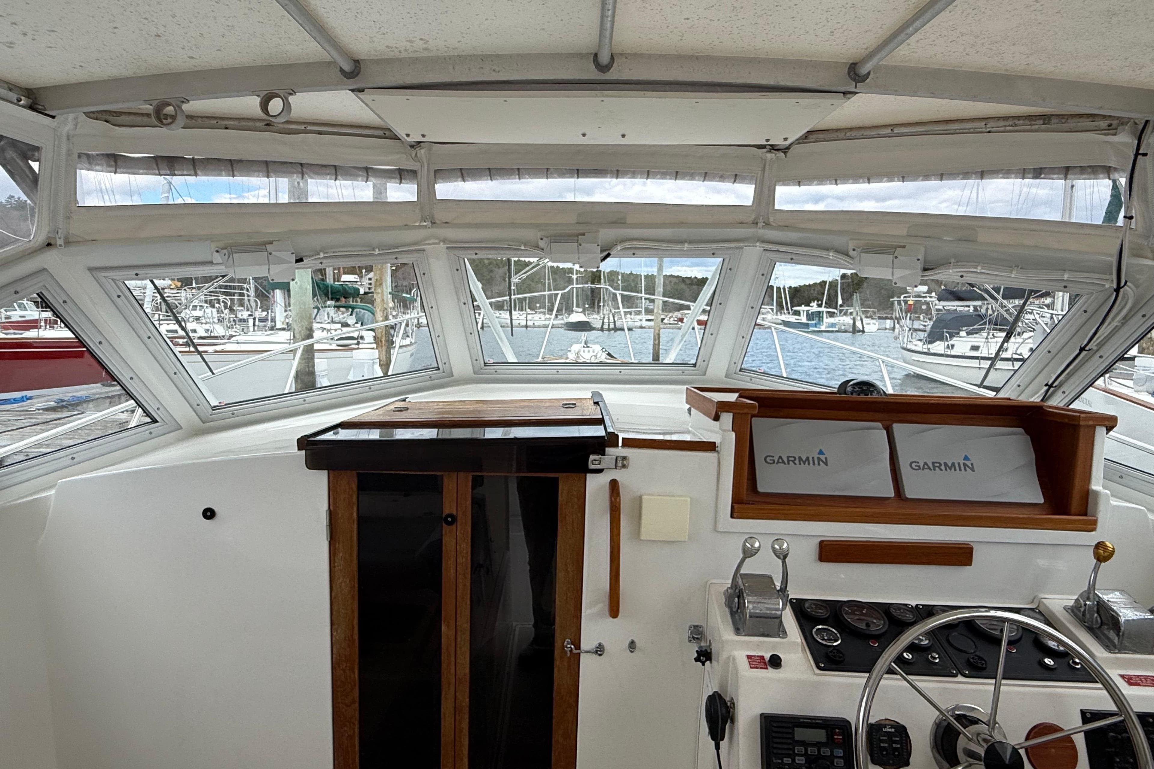 Interior view of 1993 Black Watch 33 boat cockpit with Garmin navigation.
