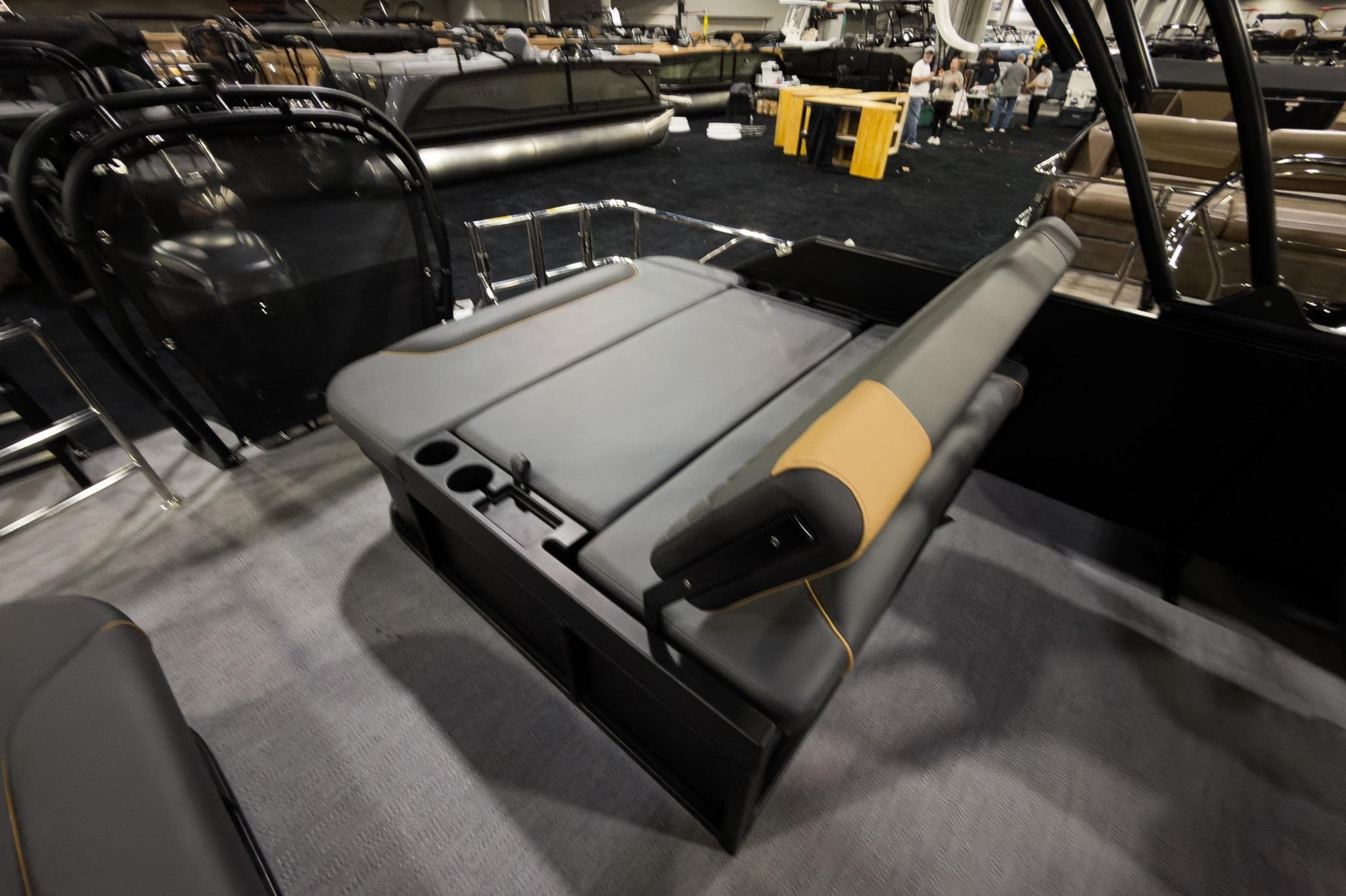 2026 Godfrey Sweetwater 22' Tritoon with single flip lounge seating, showcased indoors.